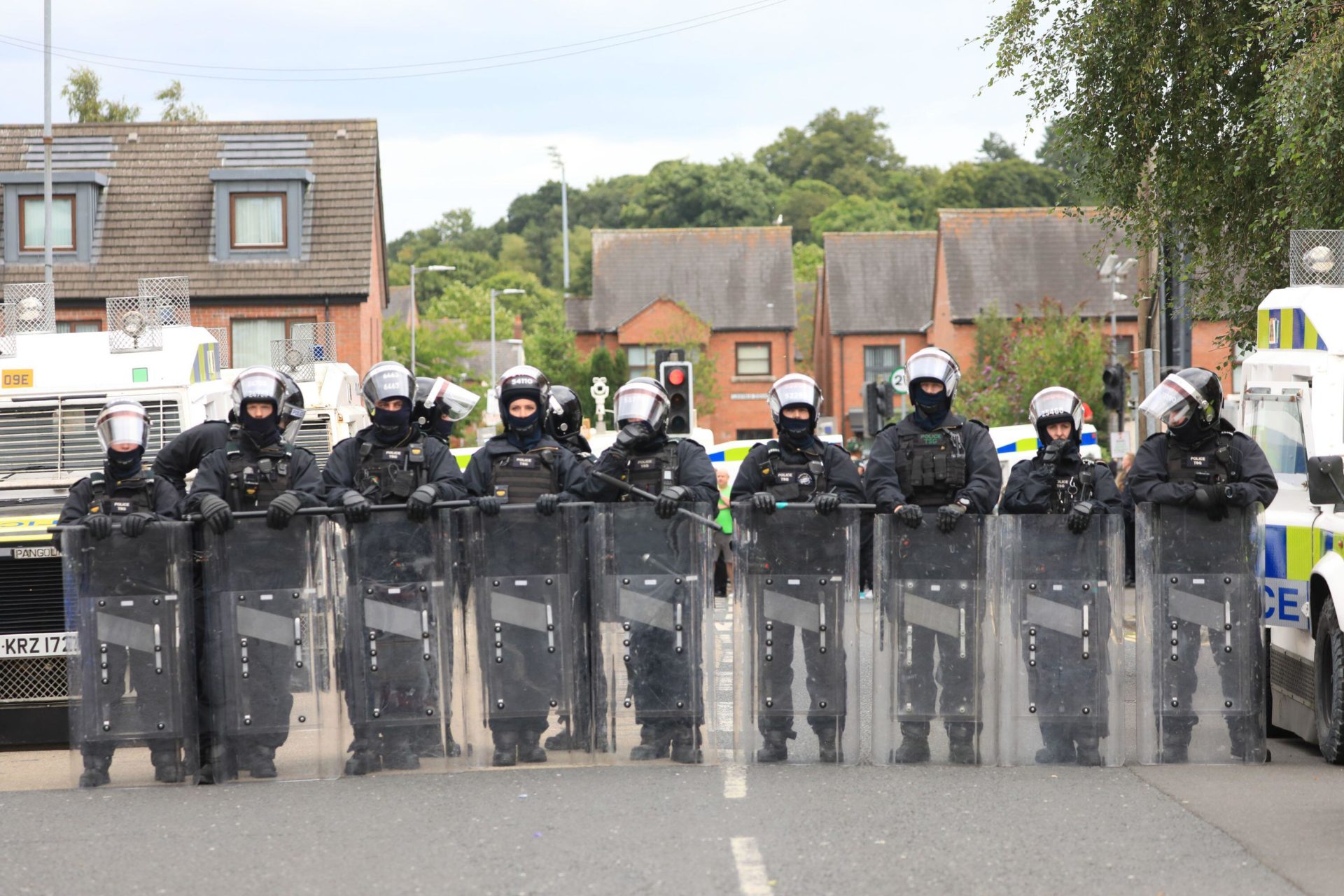 Riot police form a line on the Lower Ormeau road after people taking part in an anti-Islamic protest make their way through the area following a protest outside Belfast City Hall, 03/08/2024. Image:  PA Images / Alamy Stock Photo