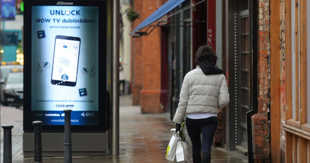 A woman walking in an empty street in Dublin during Level 5 COVID-19 lockdown