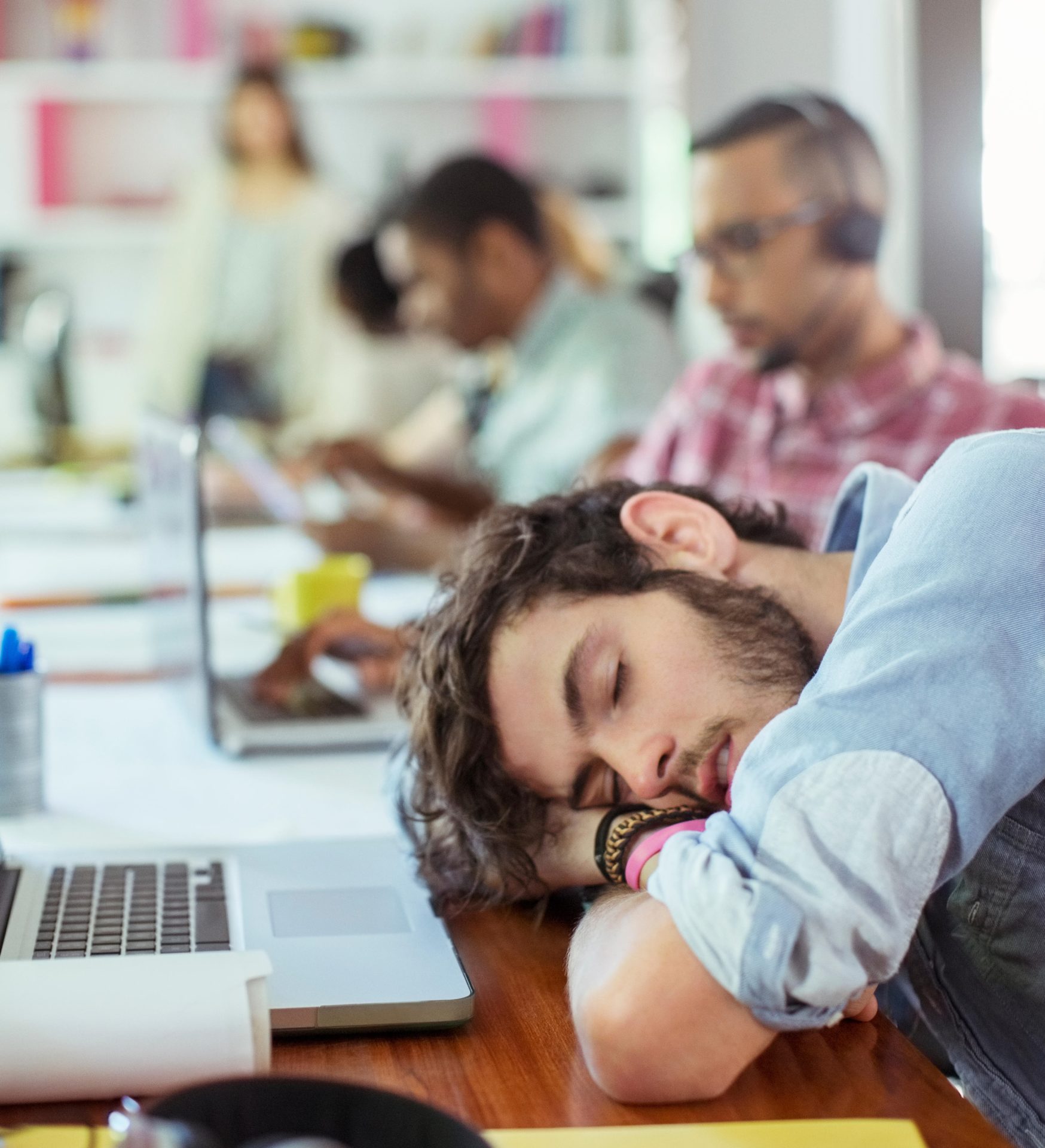 A man sleeping at an office desk, 22-2-14.