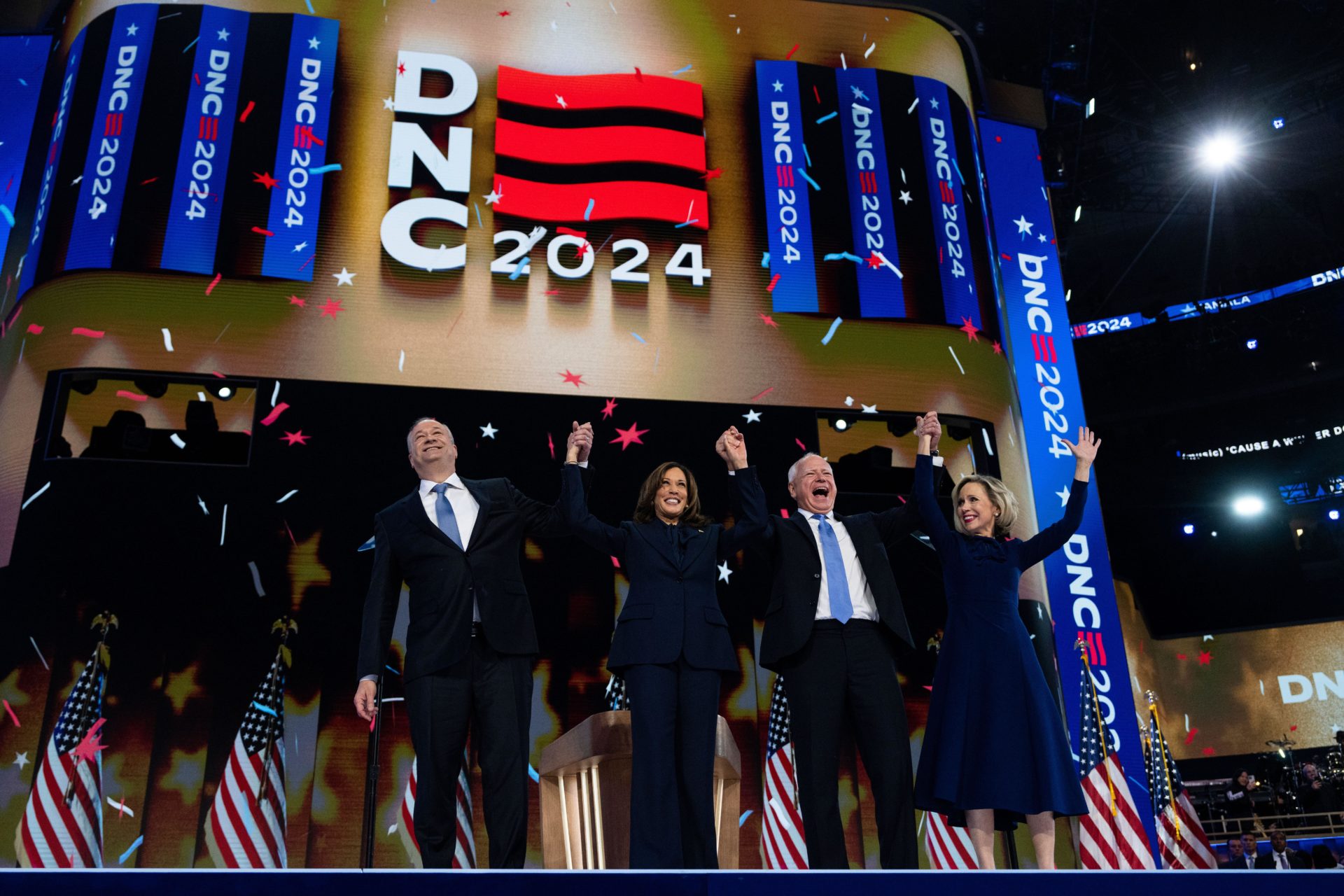 Vice President Kamala Harris, Democratic presidential nominee, and her running mate Minnesota Gov. Tim Walz, celebrate with their spouses Doug Emhoff, left, and Gwen Walz, on the final night of the Democratic National Convention at the United Center in Chicago, Ill., on Thursday, August 22, 2024. (Tom Williams/CQ Roll Call via AP Images)