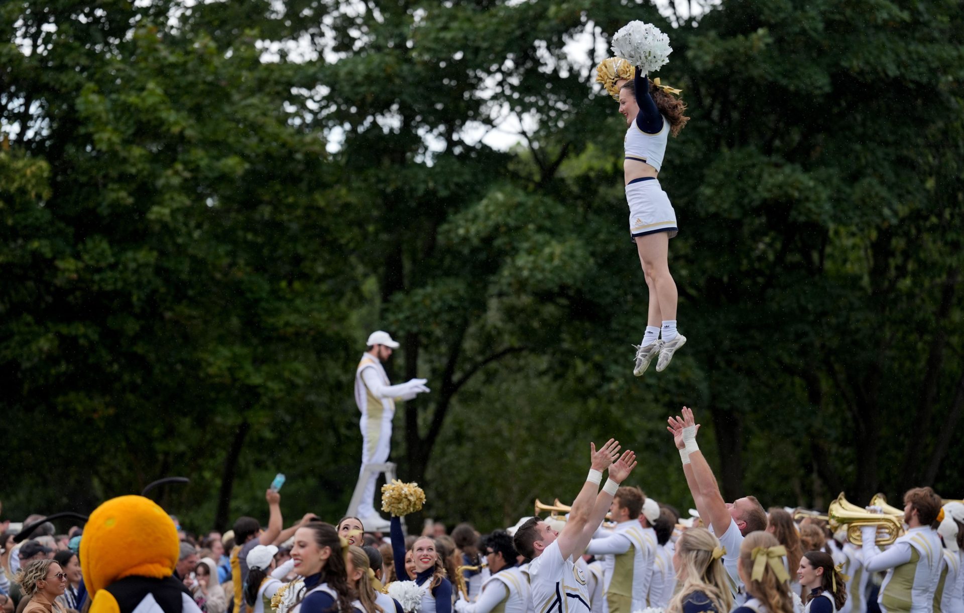 Georgia Tech cheerleaders performing at the Georgia Tech Helluva Block Party Pep Rally in Merrion Square.