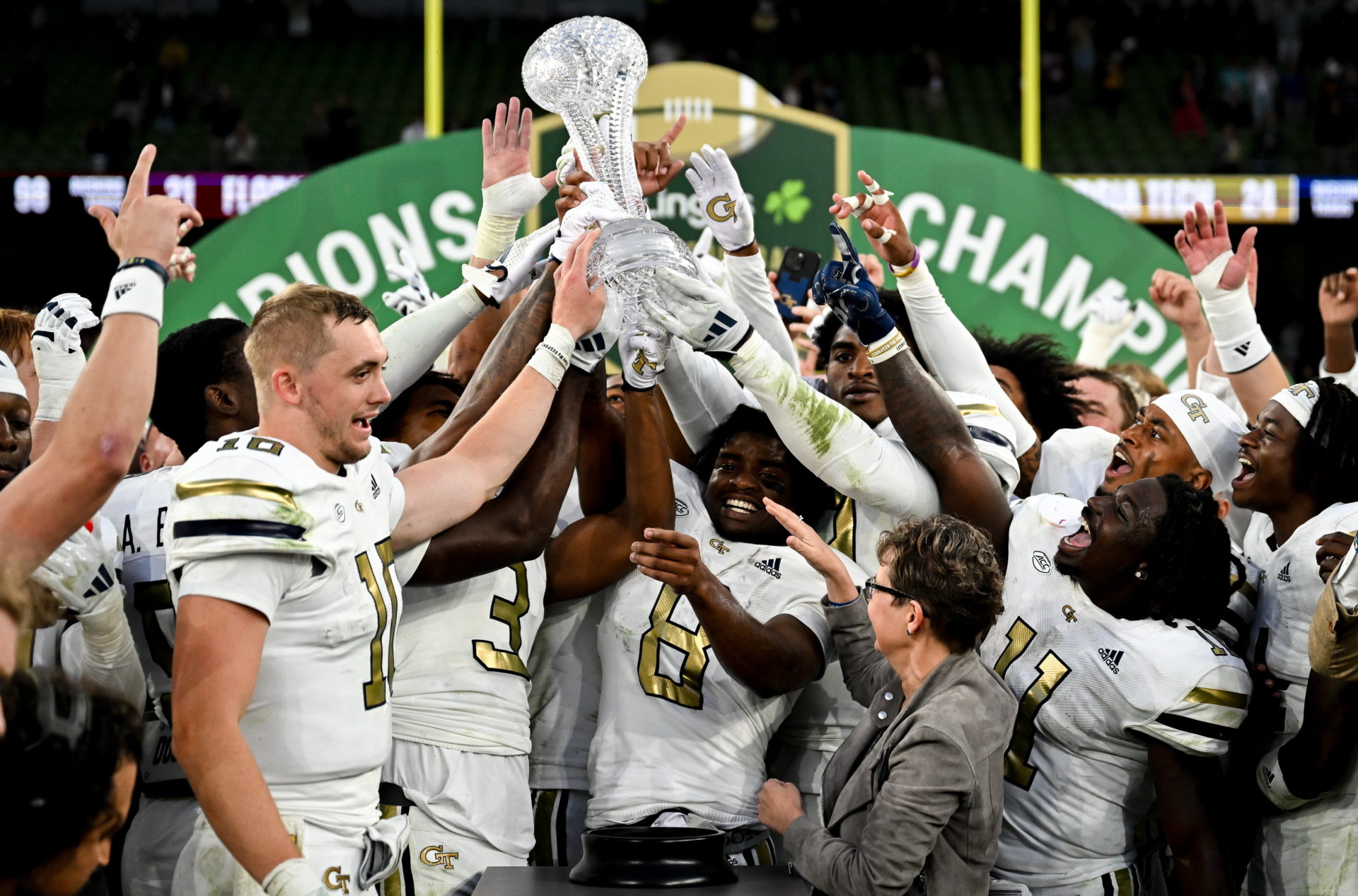 Georgia Tech players celebrate with The Keough - Naughton College Football Ireland trophy during the 2024 Aer Lingus College Football Classic match between Florida State and Georgia Tech at Aviva Stadium in Dublin. Image: Brendan Moran/Sportsfile