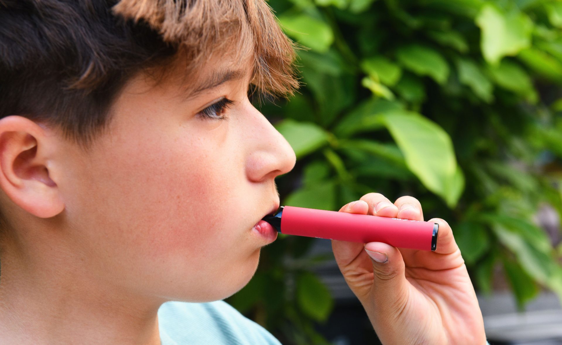 Schoolboy vaping.