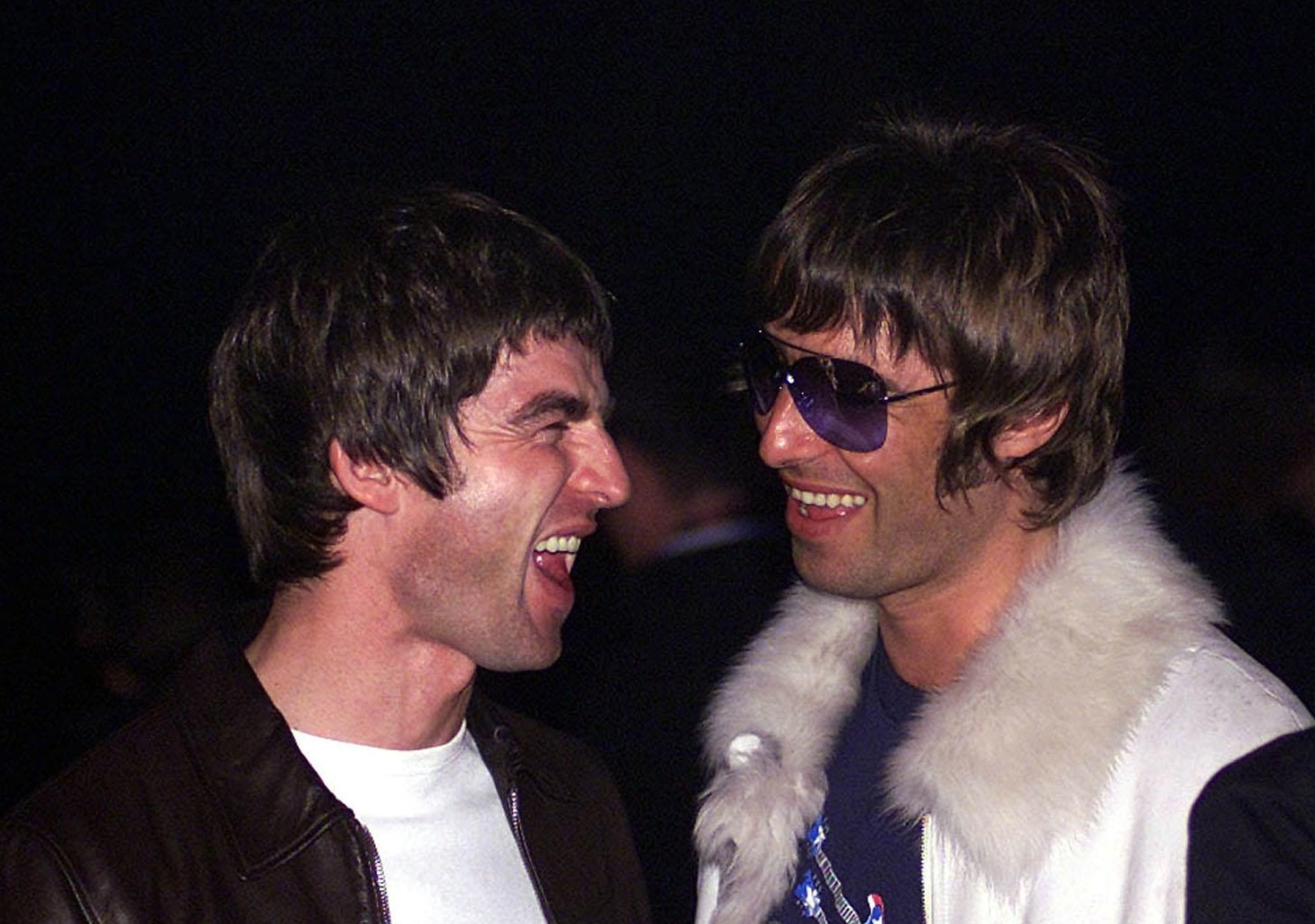 Singer-songwriter Noel Gallagher (left) and his brother Liam (right) of Oasis at the NME Carling Awards in London, 18-8-01.