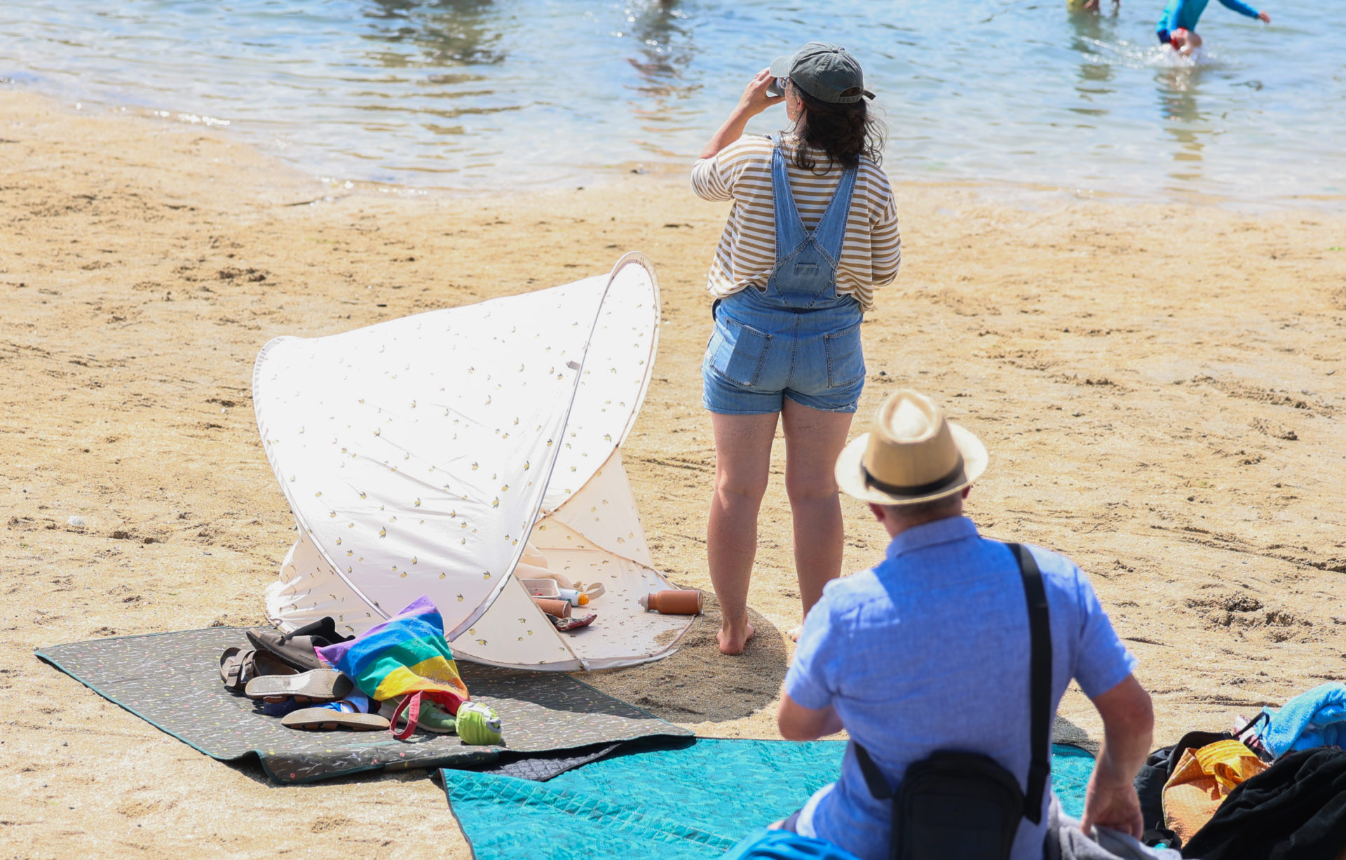 People enjoy the sunshine at Sandycove beach in Dublin.