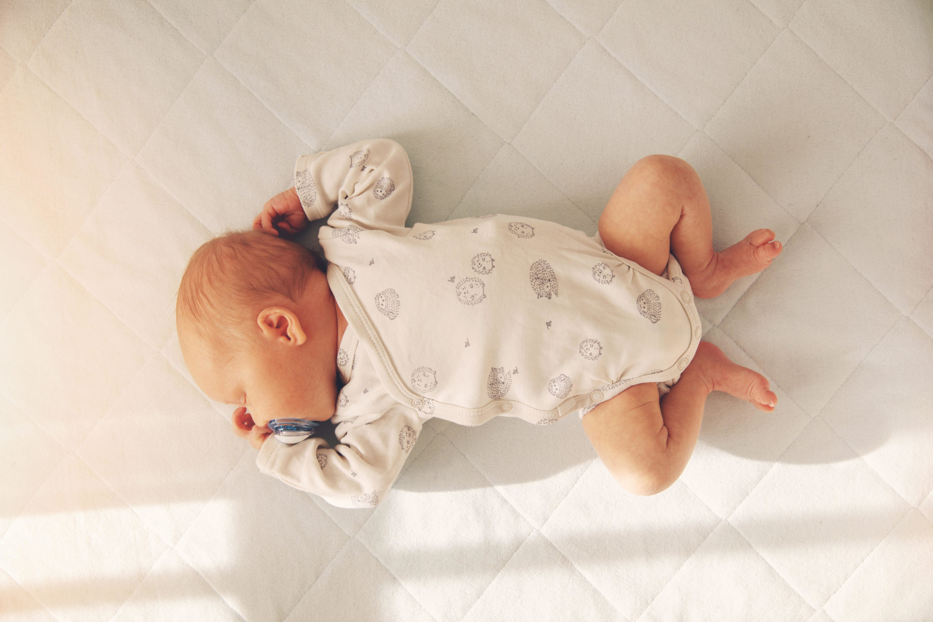 Baby sleeping in a cot. Image: ronstik / Alamy Stock Photo