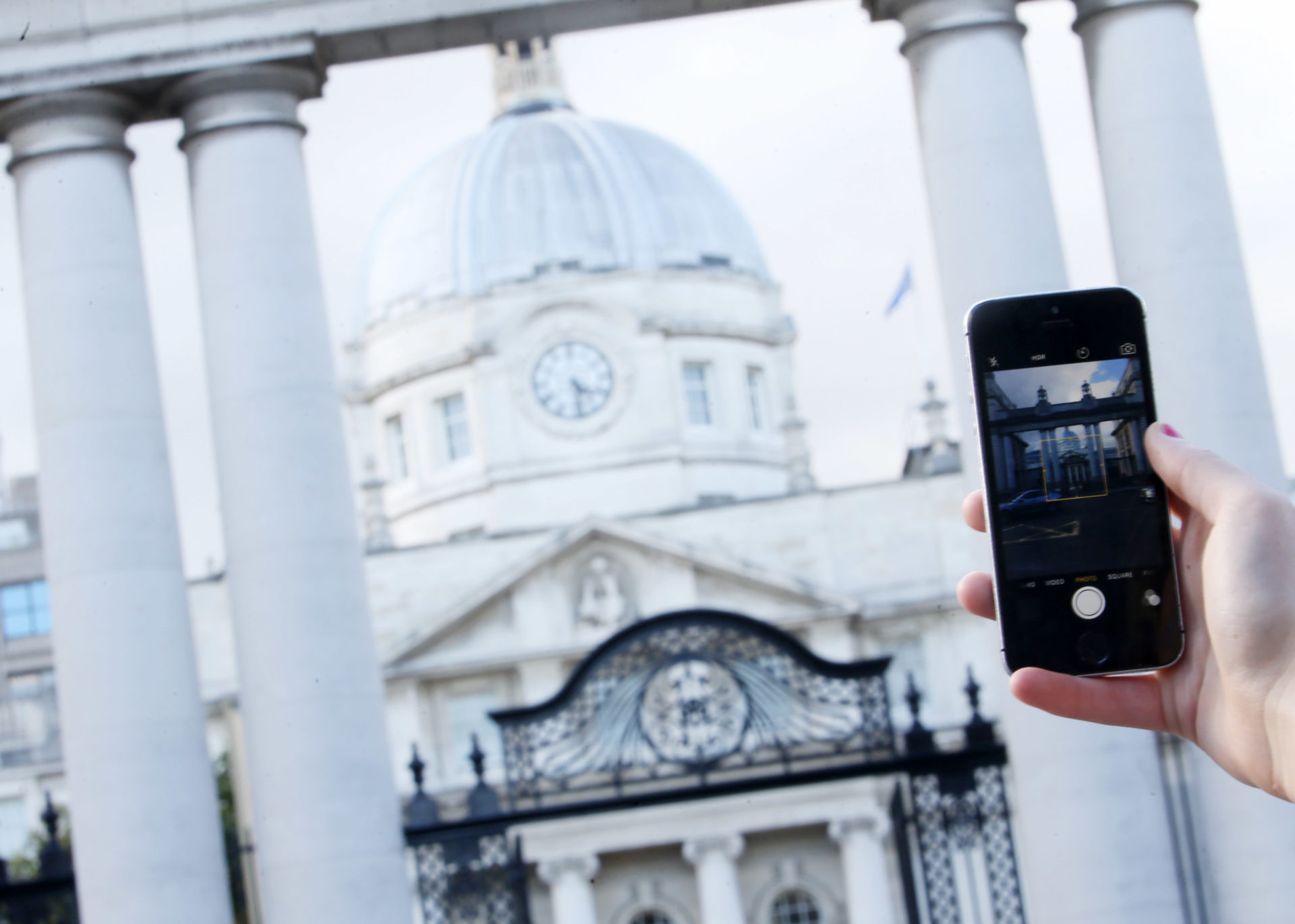 File photo shows an Apple iPhone in front of Government Buildings in Dublin