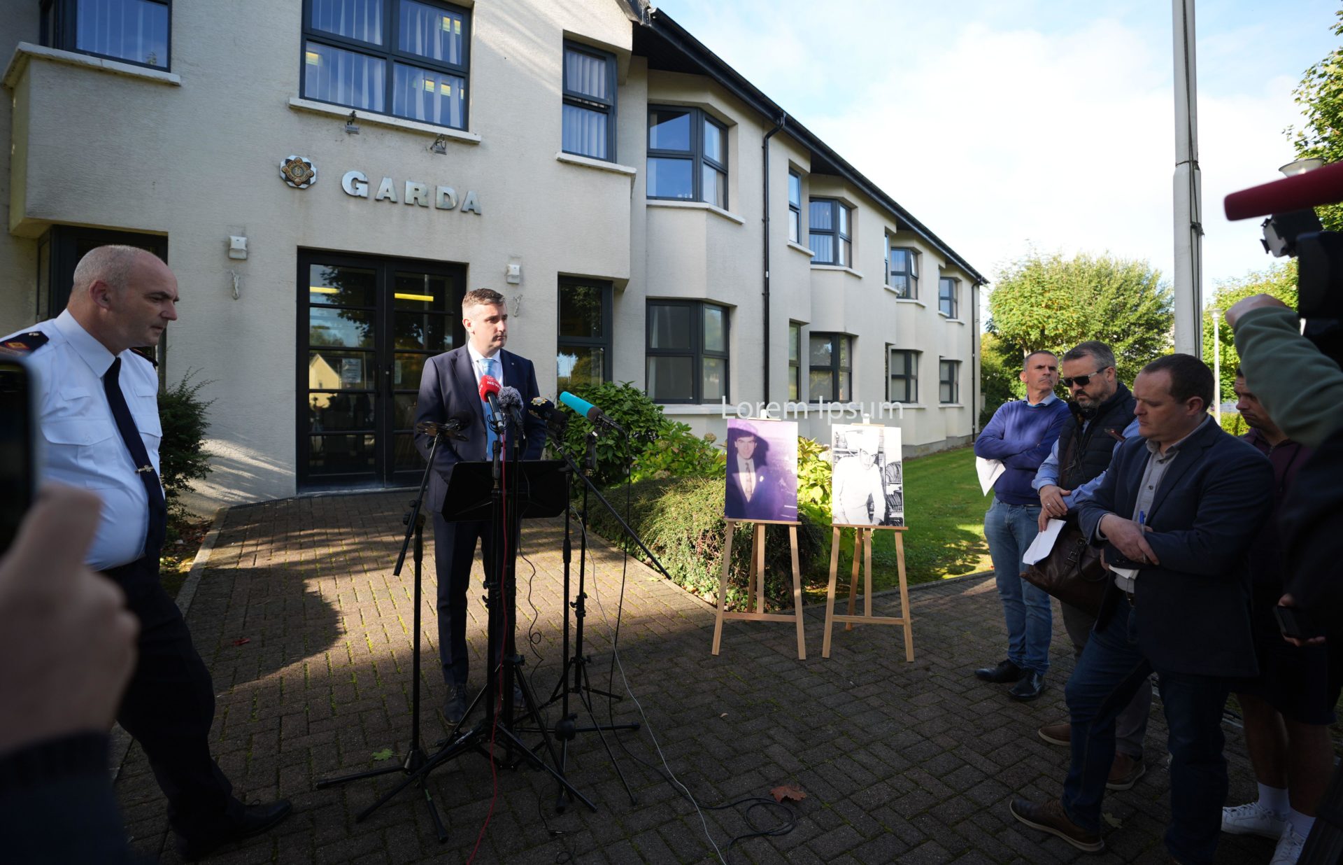 Inspector David Pinerty stands beside photographs of Patrick Nugent, 23, as he makes a fresh appeal for information at Shannon Garda Station into his death