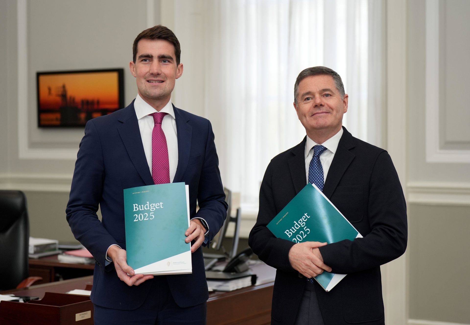 Finance Minister Jack Chambers (left) and Public Expenditure Minister Paschal Donohoe with Budget 2025 at the Department of Finance in Dublin