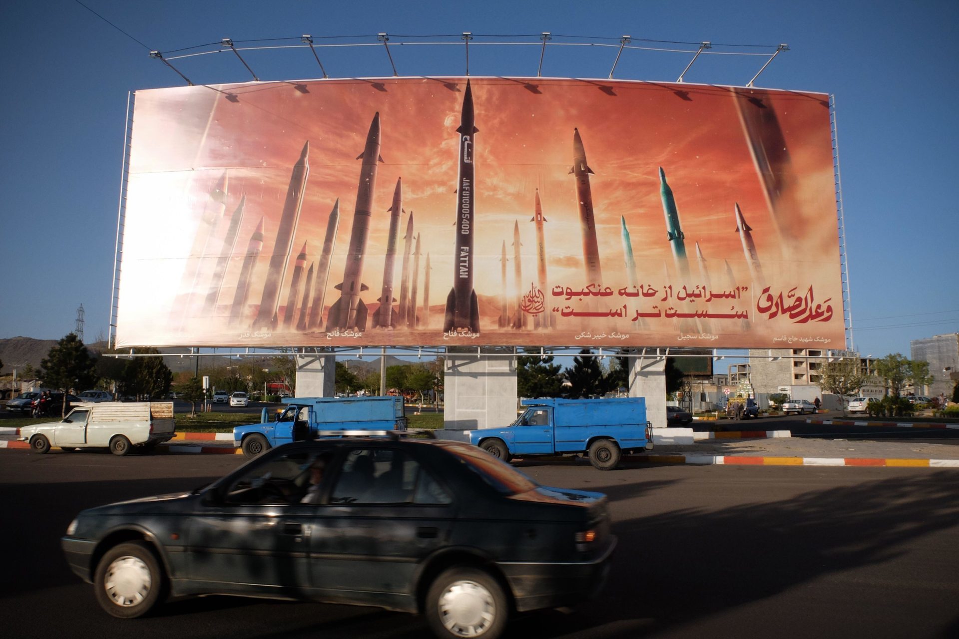 An anti-Israel billboard in Iran carrying pictures of Iranian missiles and a sentence reading in Persian, 'Israel is weaker than spider home'