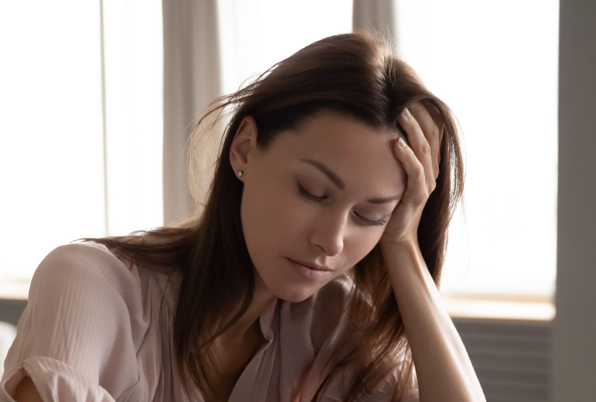 A sleepy woman sitting at a desk, 20-9-19.