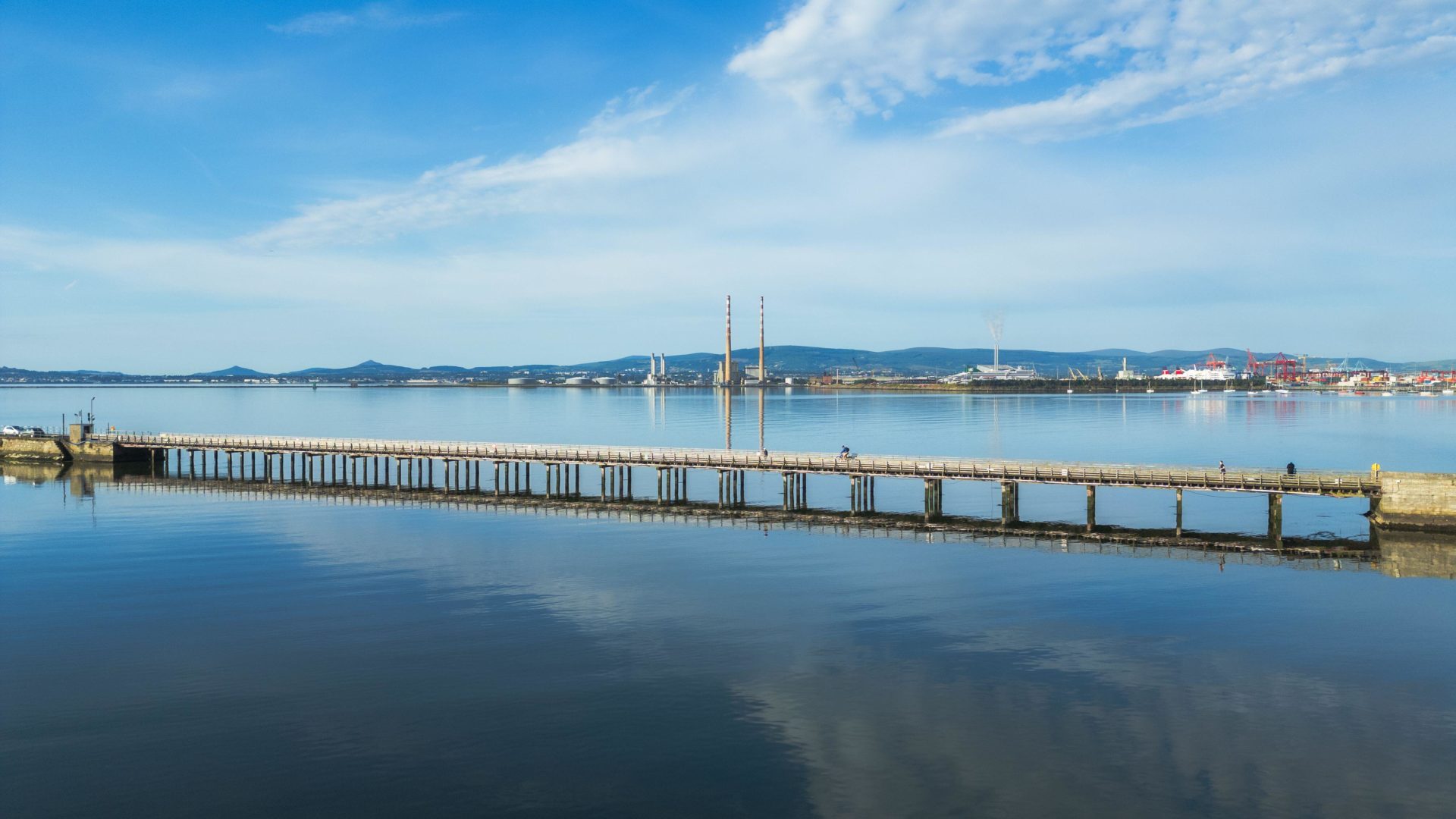 Wooden Bridge and Poolbeg reflections in the water at Clontarf in Dublin