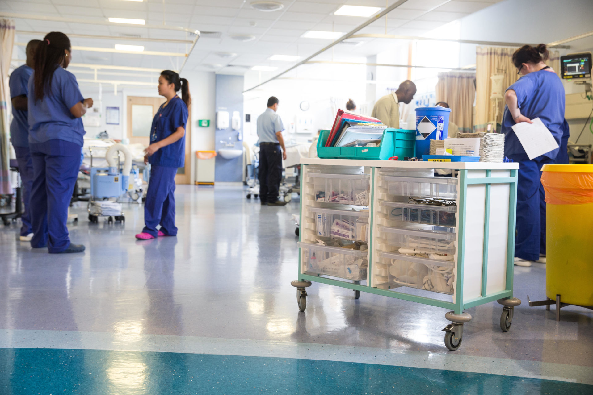 A busy hospital ward with nurses and a trolley, 21-4-16. 