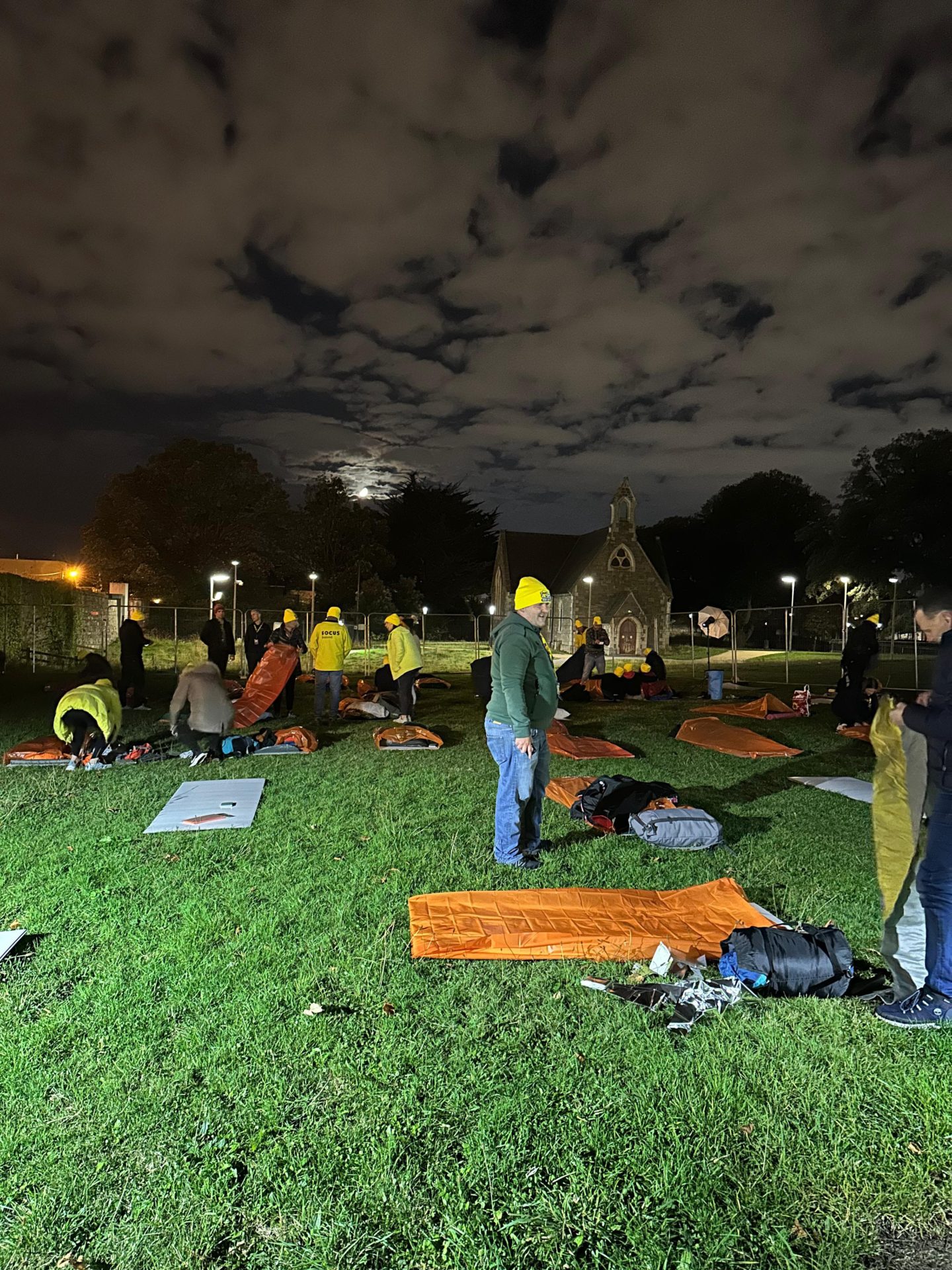 People join Focus Ireland's Shine-A-Light sleepout in Dublin.