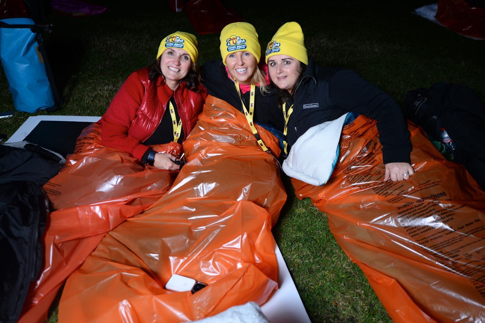 People join Focus Ireland's Shine-A-Light sleepout in Dublin.