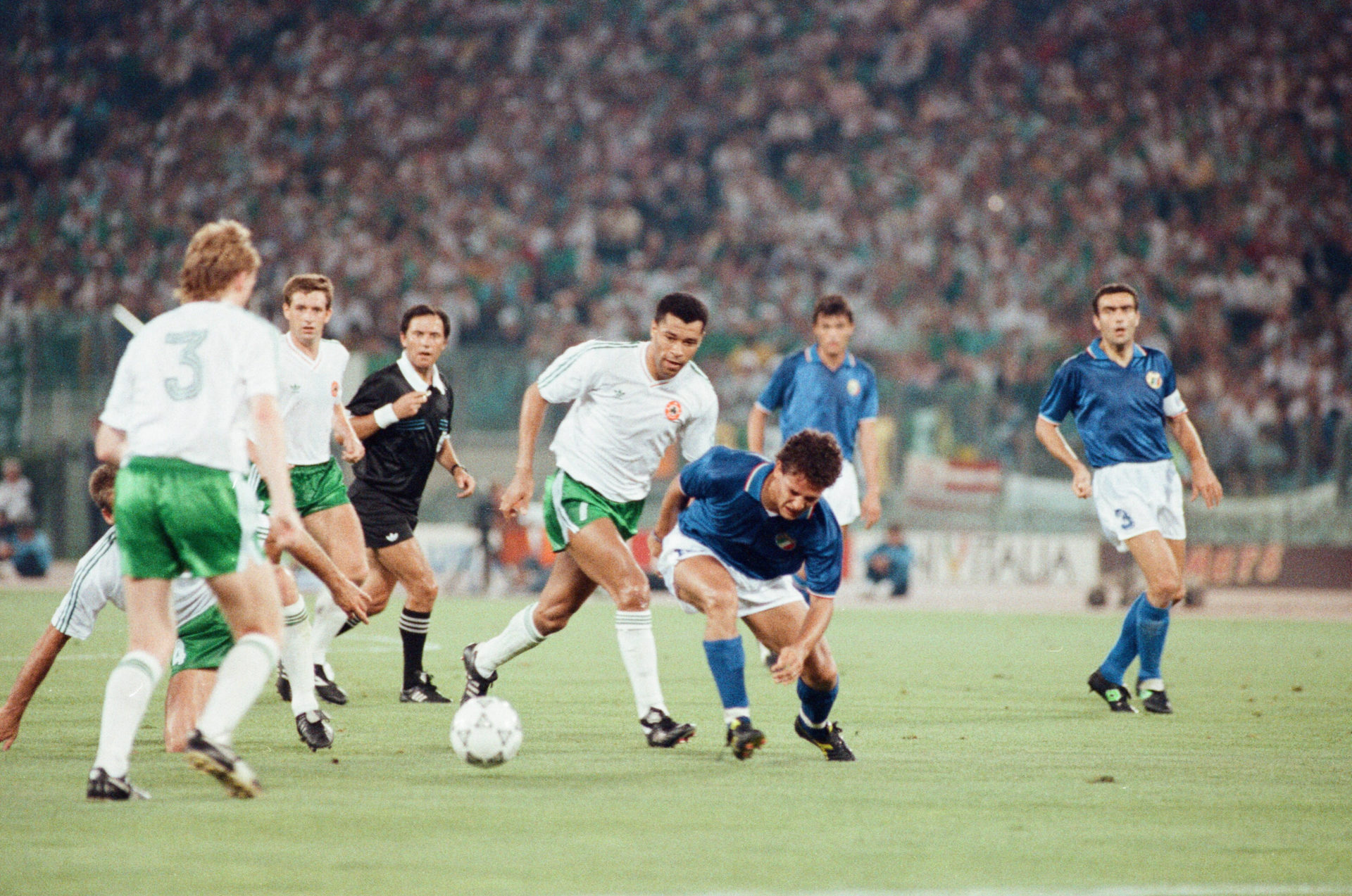 Paul McGrath chases down Italy’s Roberto Baggio during the 1990 World Cup Quarter Final in Rome