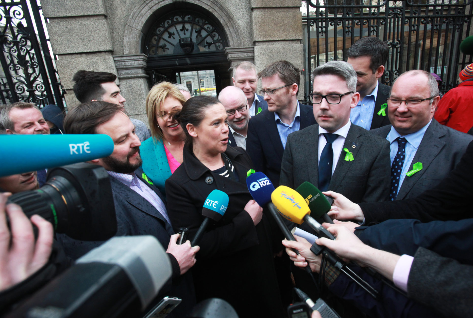 Mary Lou McDonald and Niall ? Donnghaile at the entrance to Leinster House