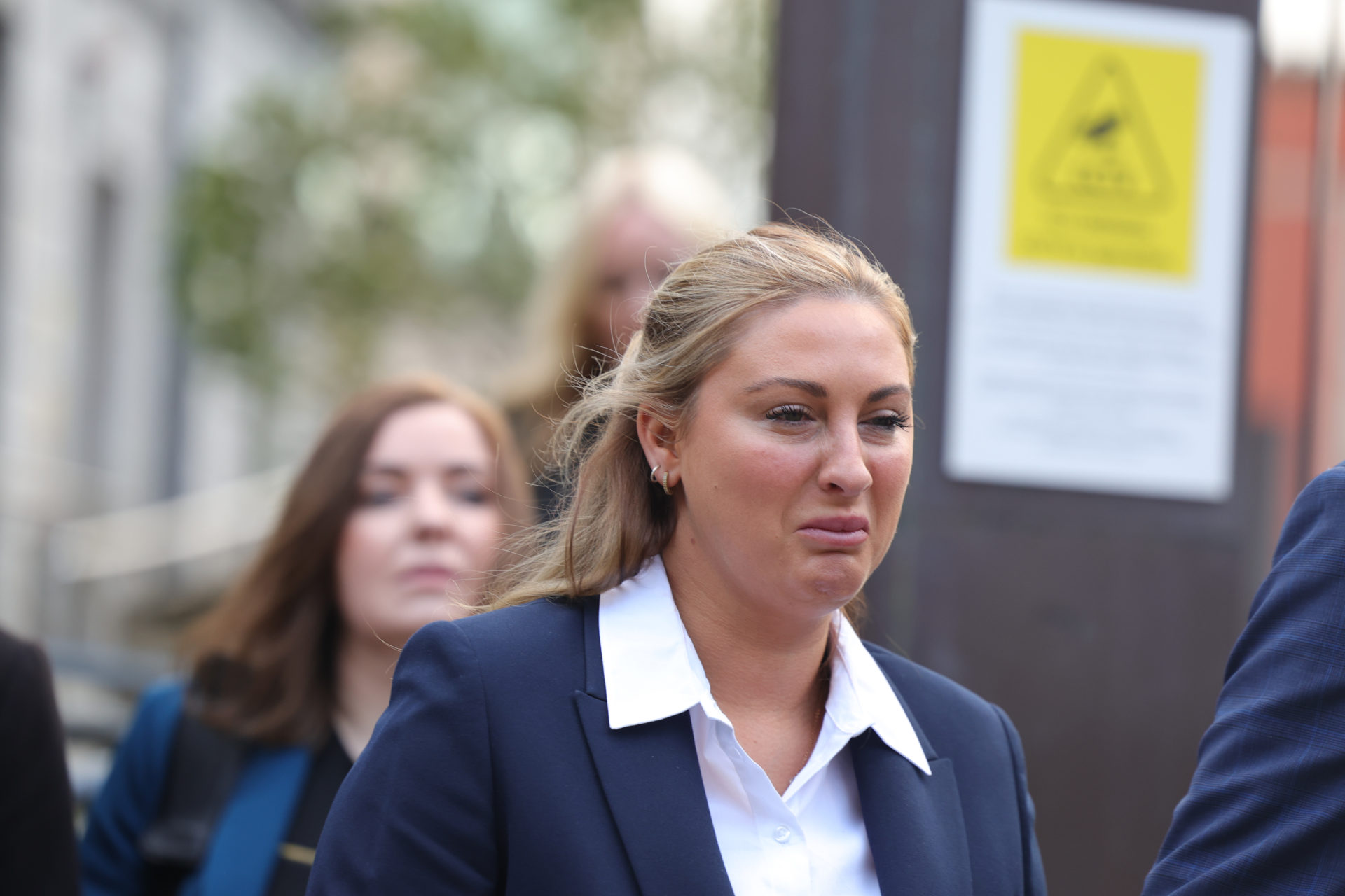 A visibly emotional Nikita Hand leaves the High Court today during her personal injuries case against UFC fighter Conor McGregor