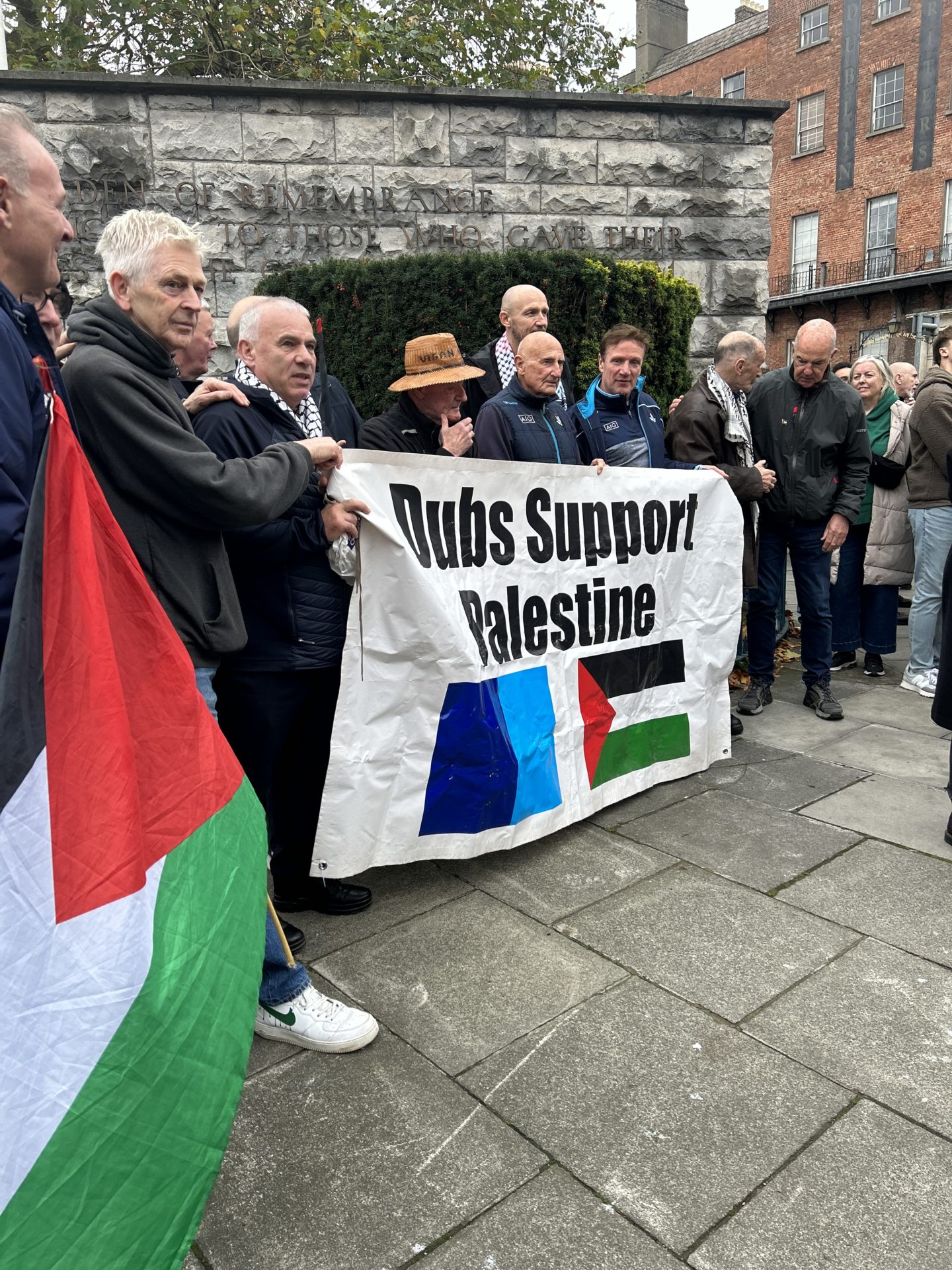 Protesters holding a 'Dubs support Palestine' flag.