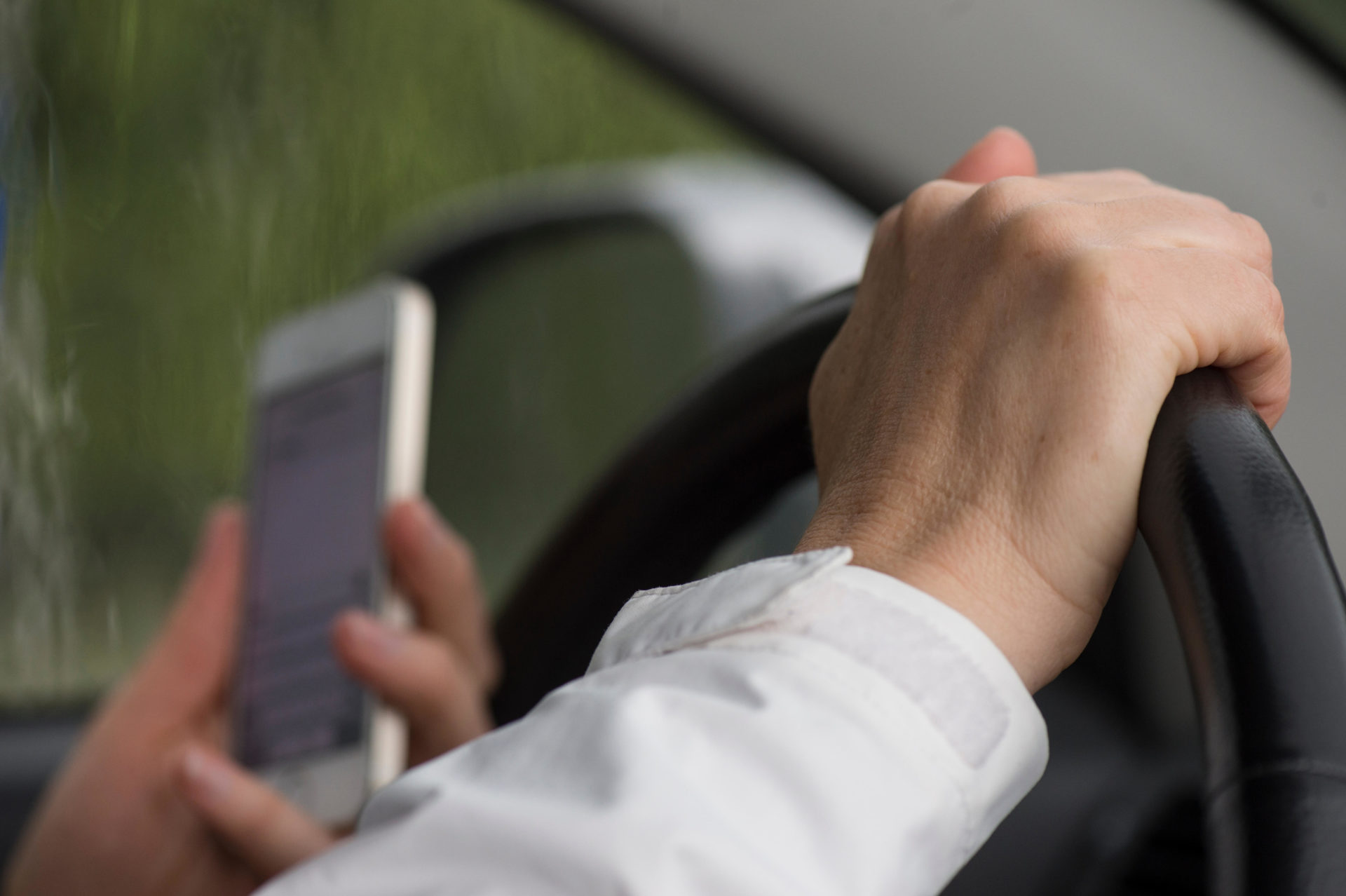 Reading text message while driving a car