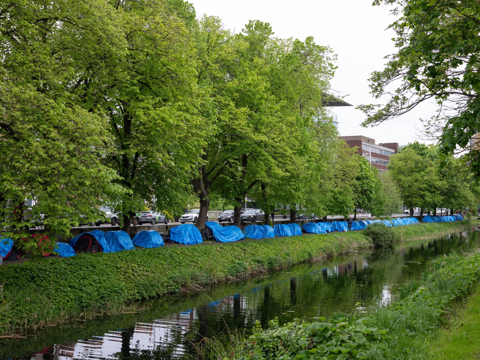 A makeshift camp of asylum seeker tents on the Grand Canal in Dublin city, Ireland.