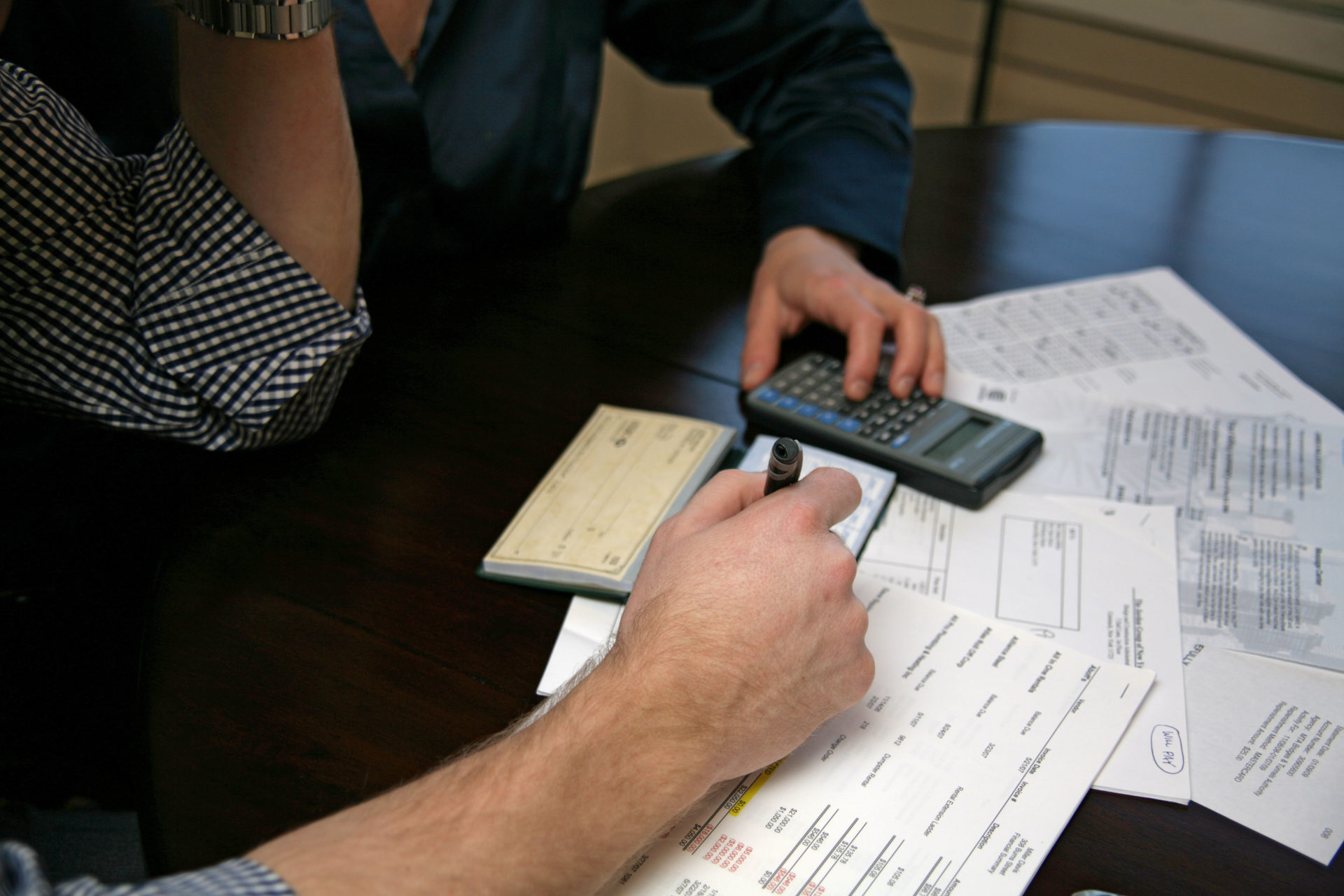 A couple looks over their finances together.