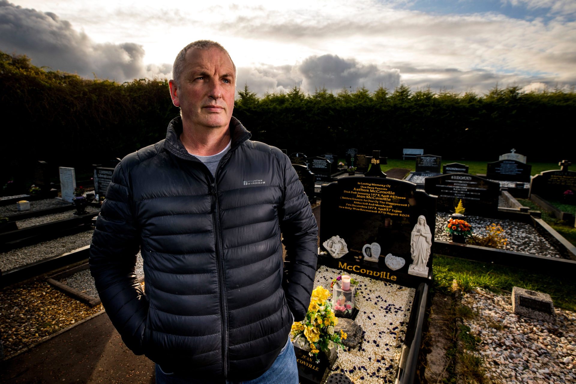 Michael McConville, son of IRA murder victim Jean McConville, at his parents grave in Lisburn, He has urged the Government to establish a public inquiry to seek answers.