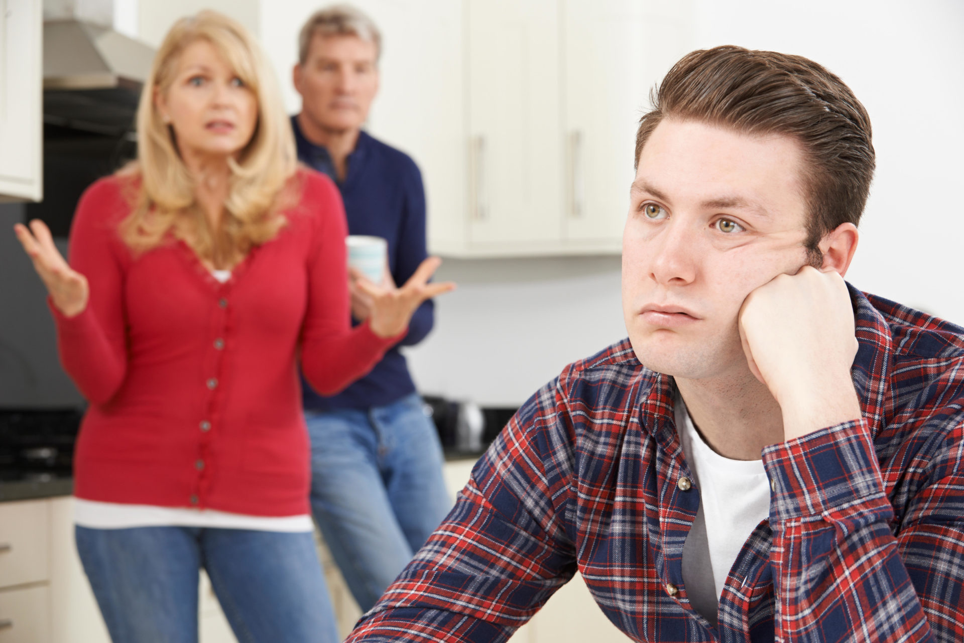 Image shows: Mature Parents Frustrated With Adult Son Living At Home. Image: Alamy Stock Photo