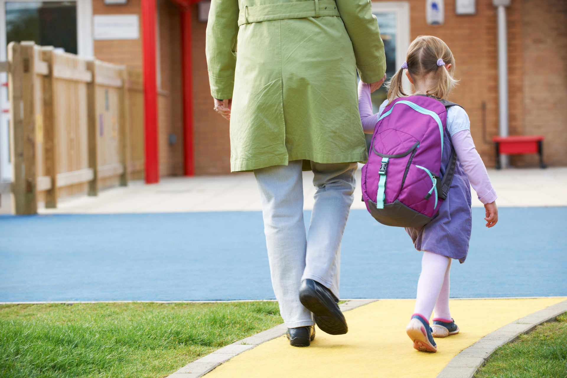 Parent taking a child to school