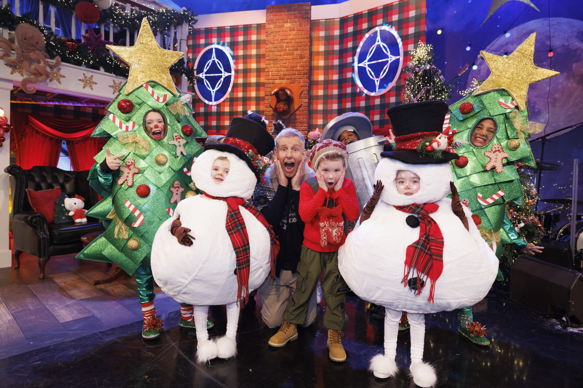 Children in Christmas costumes on the set of The Late Late Toy Show with Patrick Kielty.