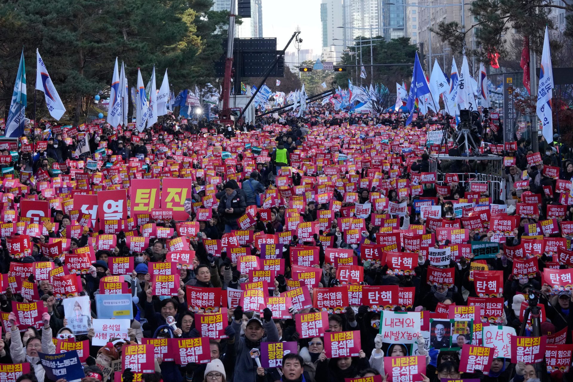 Protesters stage a rally demanding South Korean President Yoon Suk Yeol's impeachment, following the president's short-lived martial law declaration. The signs read, "Impeach Yoon Suk Yeol."