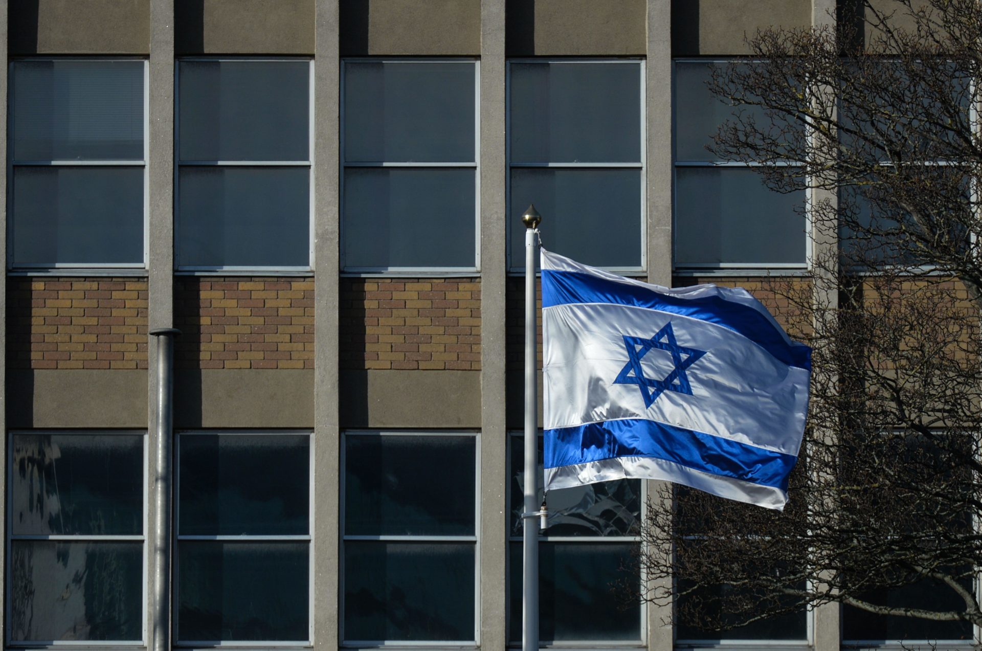 A view of the Israeli national flag in front of the Israeli Embassy in Dublin.