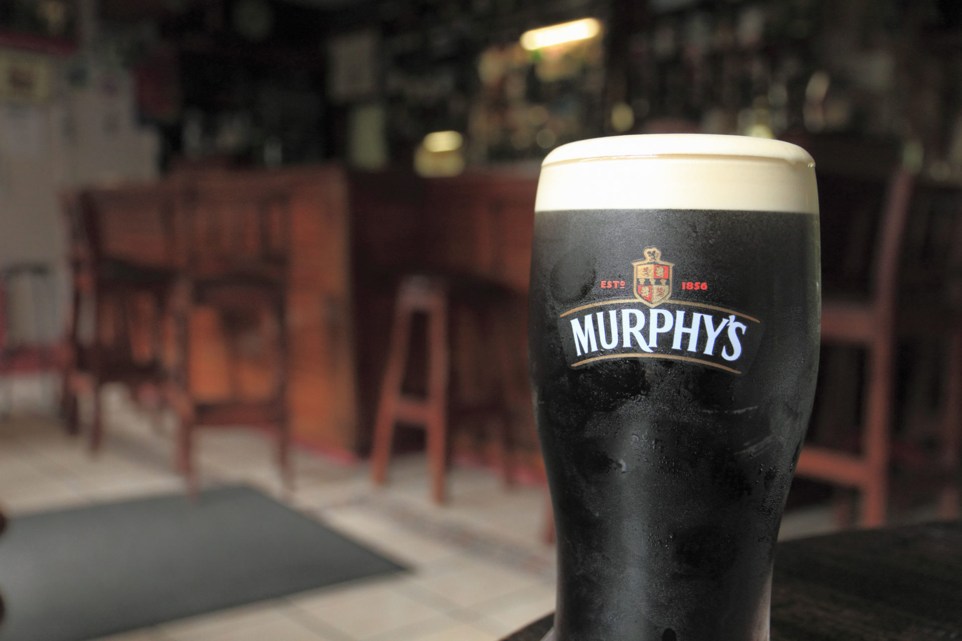 A pint of Murphy's Irish Stout rests on a table in a pub at Union Hall, West County Cork, Republic of Ireland. Image: Alamy