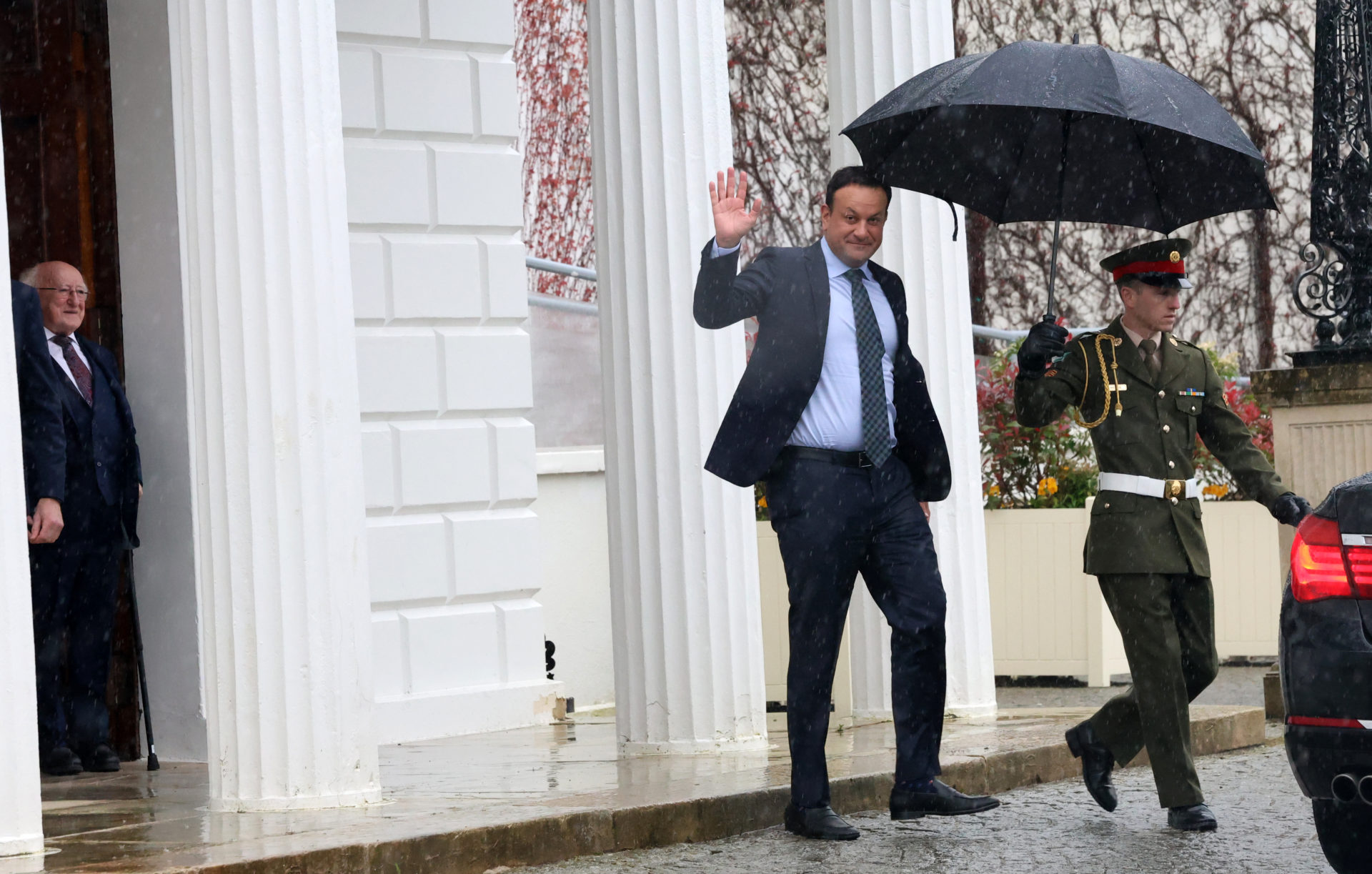 Former Fine Gael leader and Taoiseach Leo Varadkar waves goodbye while leaving Aras An Uachtarain after he resign his position.