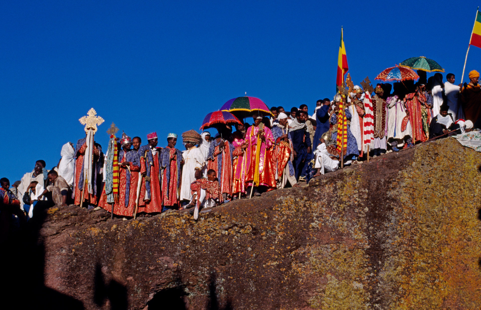 Ethiopian Christmas day celebrations (Genna), Bet Maryam Church, Lalibela, Ethiopia. Holy men carry Axunite hand crosses. Image: Alamy