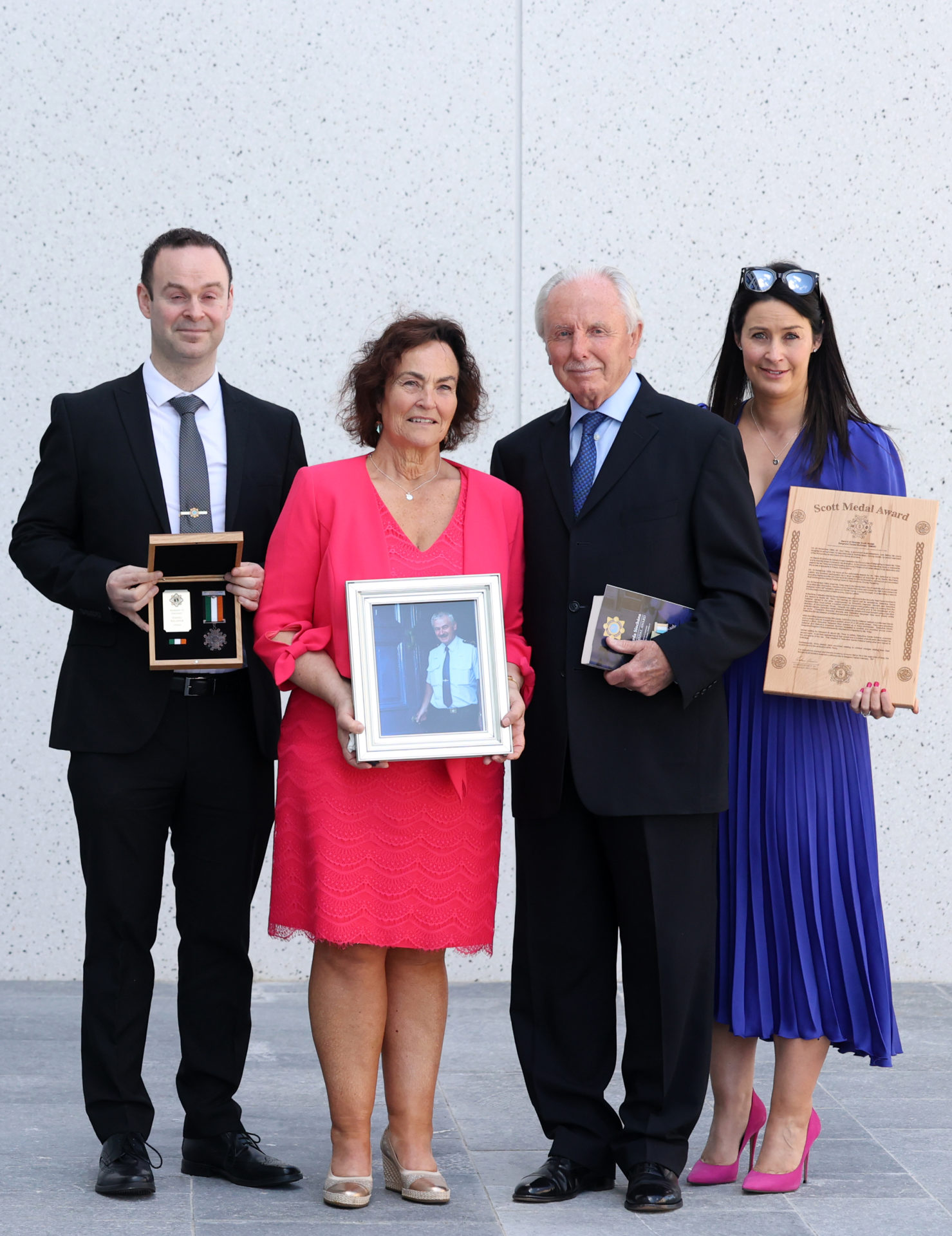 Pictured Sgt Daniel Kellehers family (LtoR) , Daniel (Son), mother Caroline, and daughter Lesslie with the Bronze Scott Medal (Posthumously) to Sgt Daniel Kelleher with (2nd center) Mr Don Tidey at a ceremony to award Scott Medals for bravery in Walter Scott House, Dublin. 