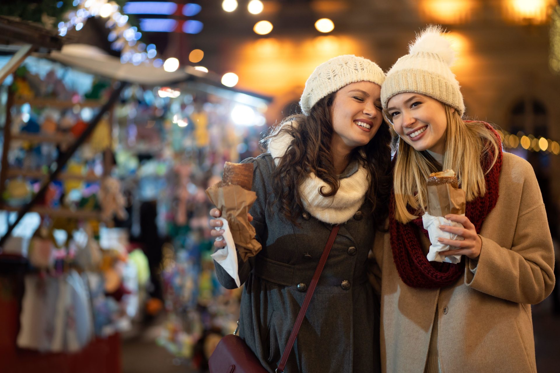 Two women enjoy a Christmas market