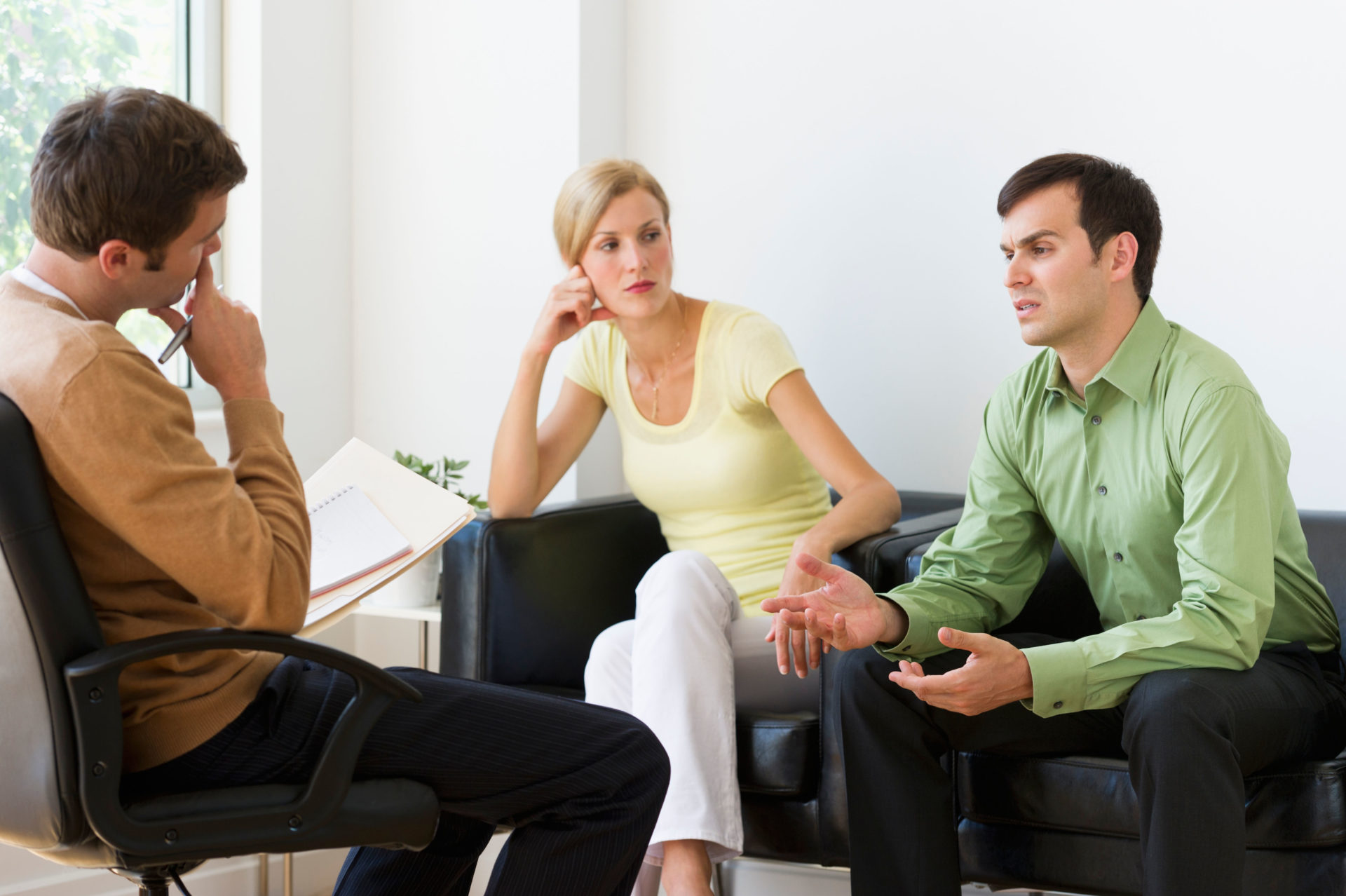 Couple discussing issues during therapy.