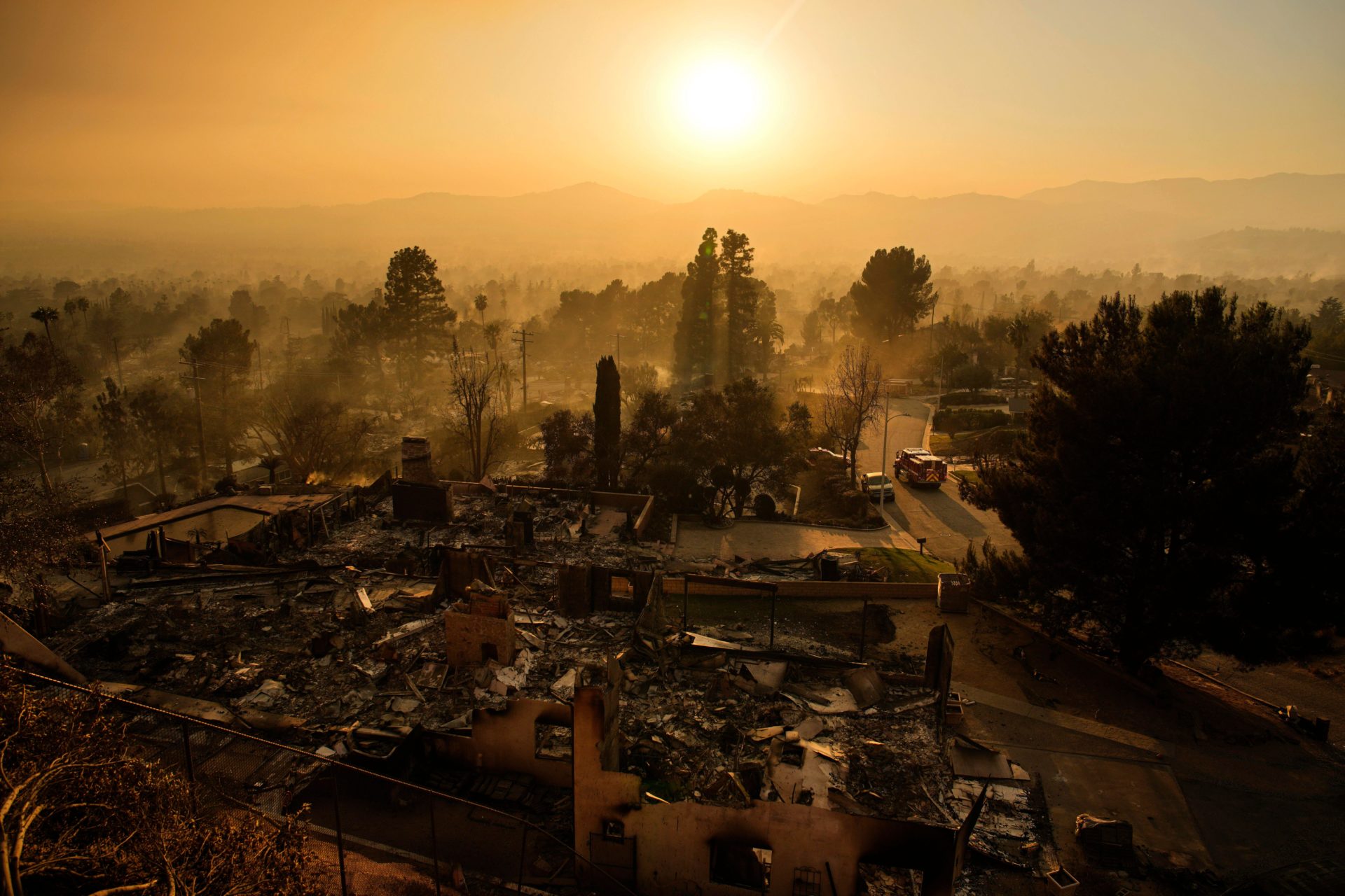 An emergency vehicle drives through a neighborhood devastated by the Eaton Fire. 09/01/2025 (AP Photo/John Locher)