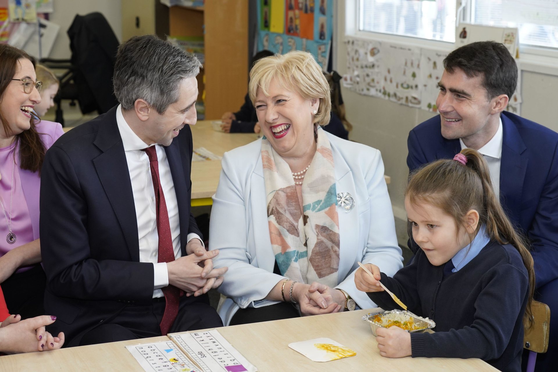 Taoiseach Simon Harris and Minister for Social Protection and Rural and Community Development Heather Humphreys meeting school children during the announcement at St Thomas' Junior National School, Esker, Lucan, on the roll-out of the Hot School Meals Pro