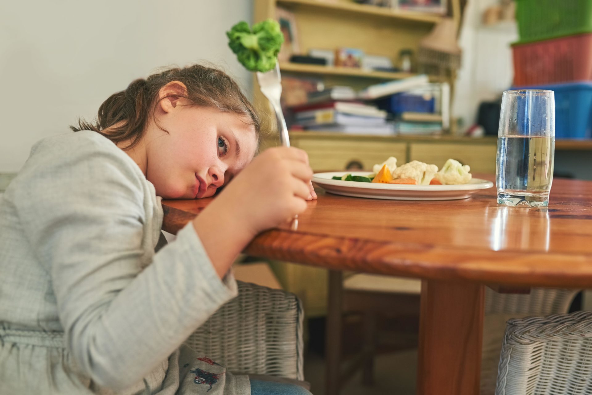 A little girl refusing to eat her broccoli. Image: Alamy