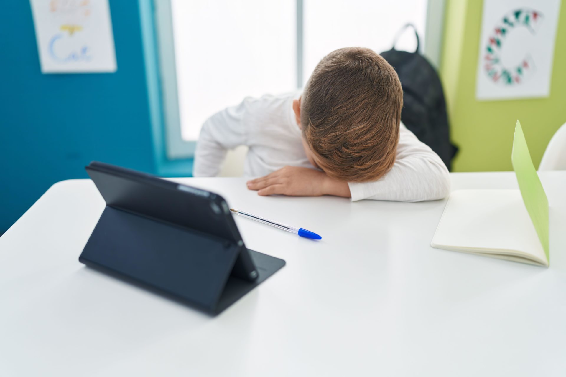 Student leaning on the desk in a classroom. Image: Alamy