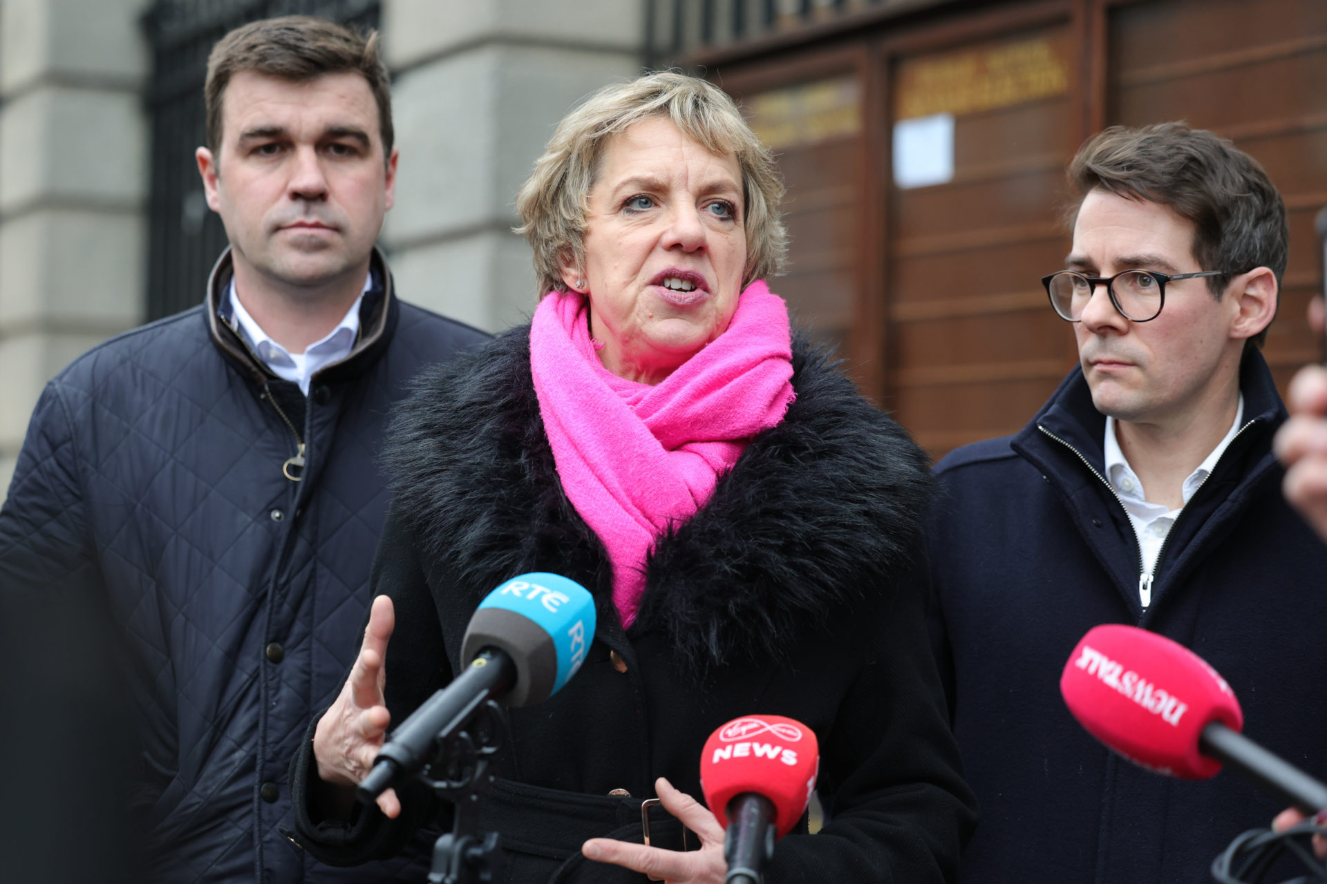  Dublin, Ireland. Labour leader Ivana Bacik speaks to media outside Leinster House with colleagues Deputy Duncan Smith and Deputy Ciaran Ahern following their meeting with the Social Democrats 