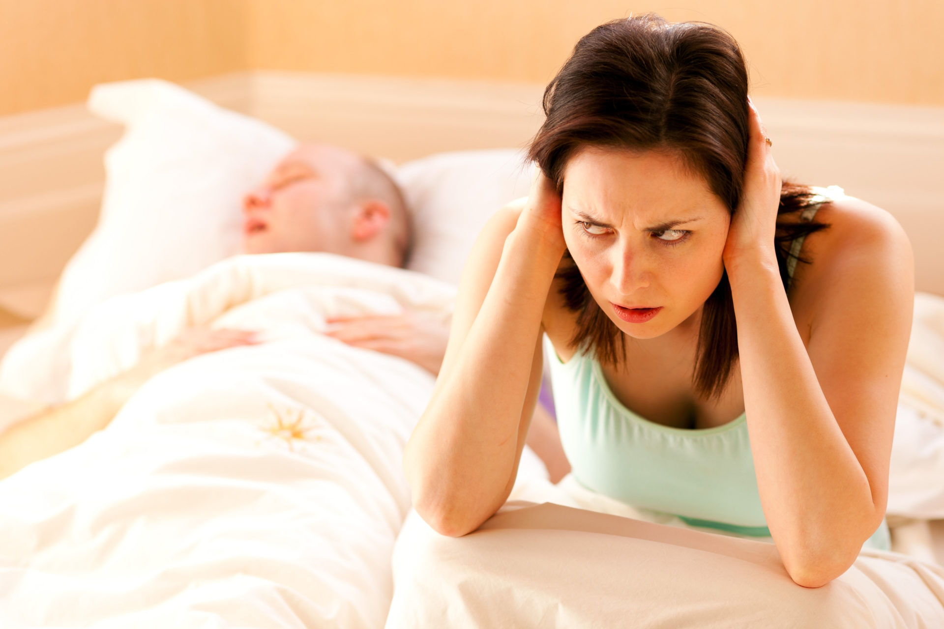 Woman fed up of partner snoring. Image: Alamy