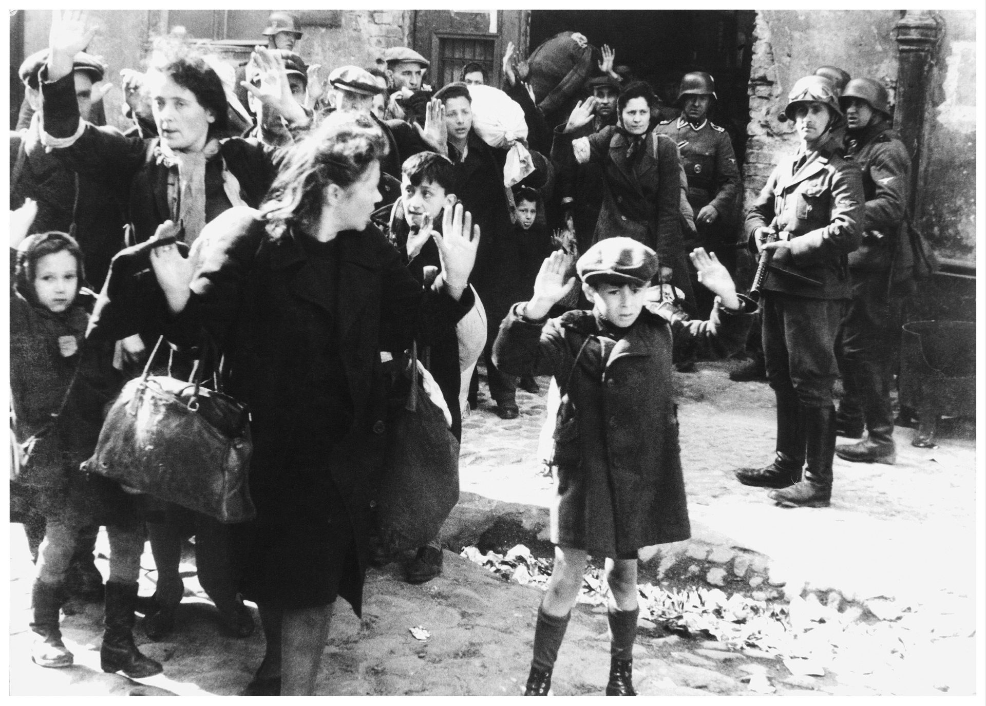 Holocaust; World war two: Warsaw Jews at gunpoint. SS troops look on. Warsaw Ghetto 1943. 