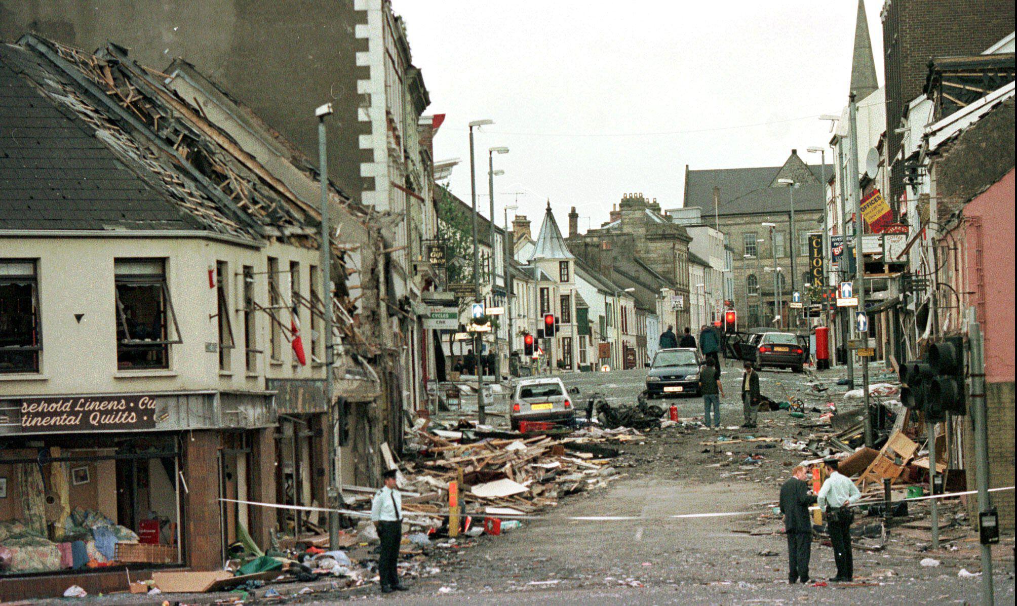 This is a Saturday, Aug. 15, 1998 file photo showing Royal Ulster Constabulary Police officers stand on Market Street, the scene of a car bombing in the centre of Omagh, Co Tyrone, 72 miles west of Belfast, Northern Ireland. Four IRA dissidents were found liable Monday June 8, 2009 for the worst terrorist attack in Northern Ireland in a landmark civil case brought by the families of the 29 people killed in the Omagh bombing. (AP Photo / Paul McErlane)