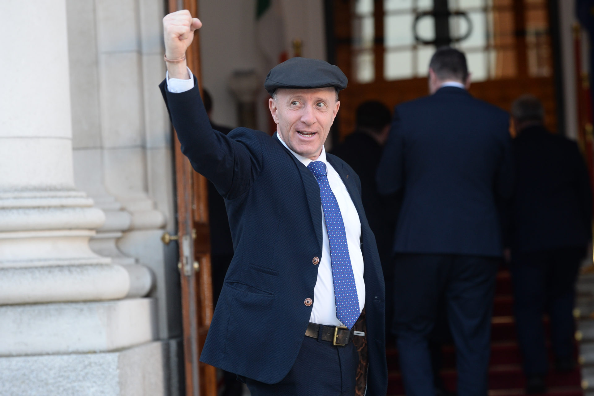 29/01/2025 Dublin, Ireland. Newly appointed Minister of State at the Department of Agriculture, Food and the Marine with special responsibility for Forestry, Farm Safety and Horticulture Michael Healy-Rae TD raises a fist in triumph as he follows Taoiseach Micheal Martin and Tanaiste Simon Harris from the Courtyard in Government Buildings, after his position was confirmed in today's meeting of the Cabinet. Photo: Justin Farrelly / © RollingNews.ie