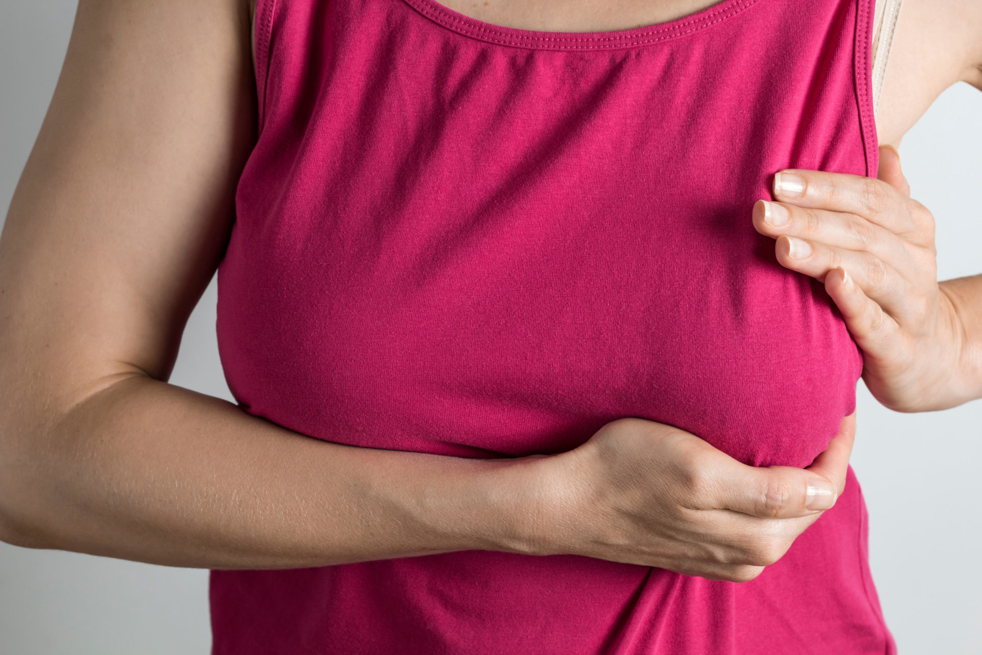 Woman performing a self breast examination. Image: Alamy