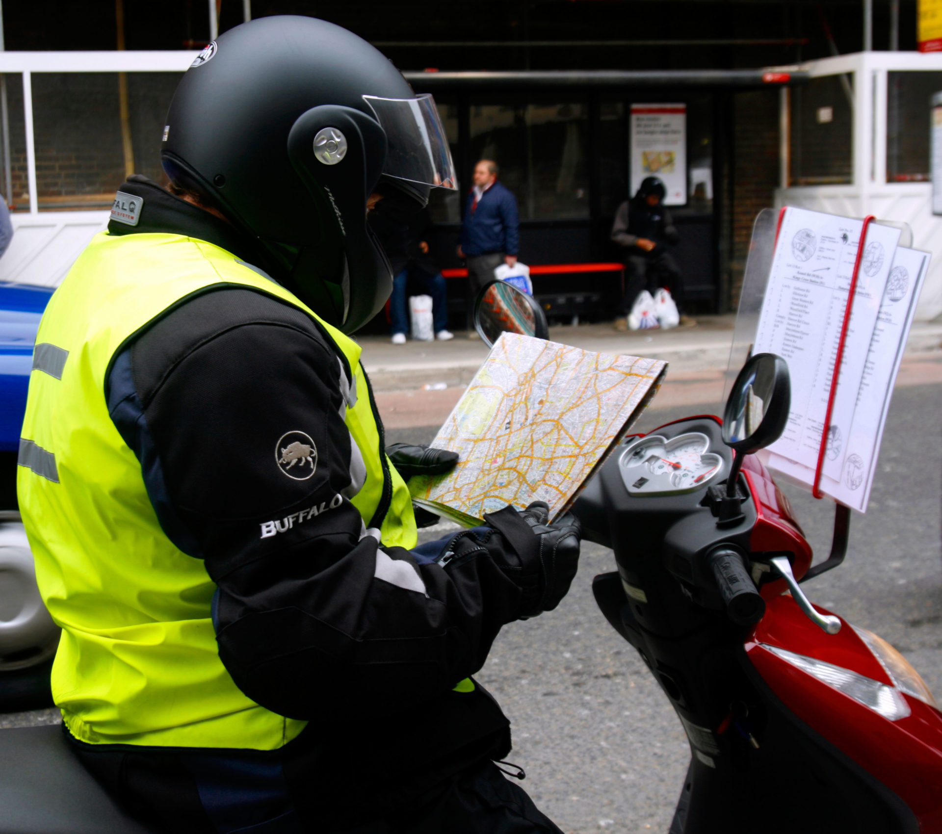 A trainee taxi driver doing 'The Knoweldge' in London. York Way, Kings Cross, London, UK.