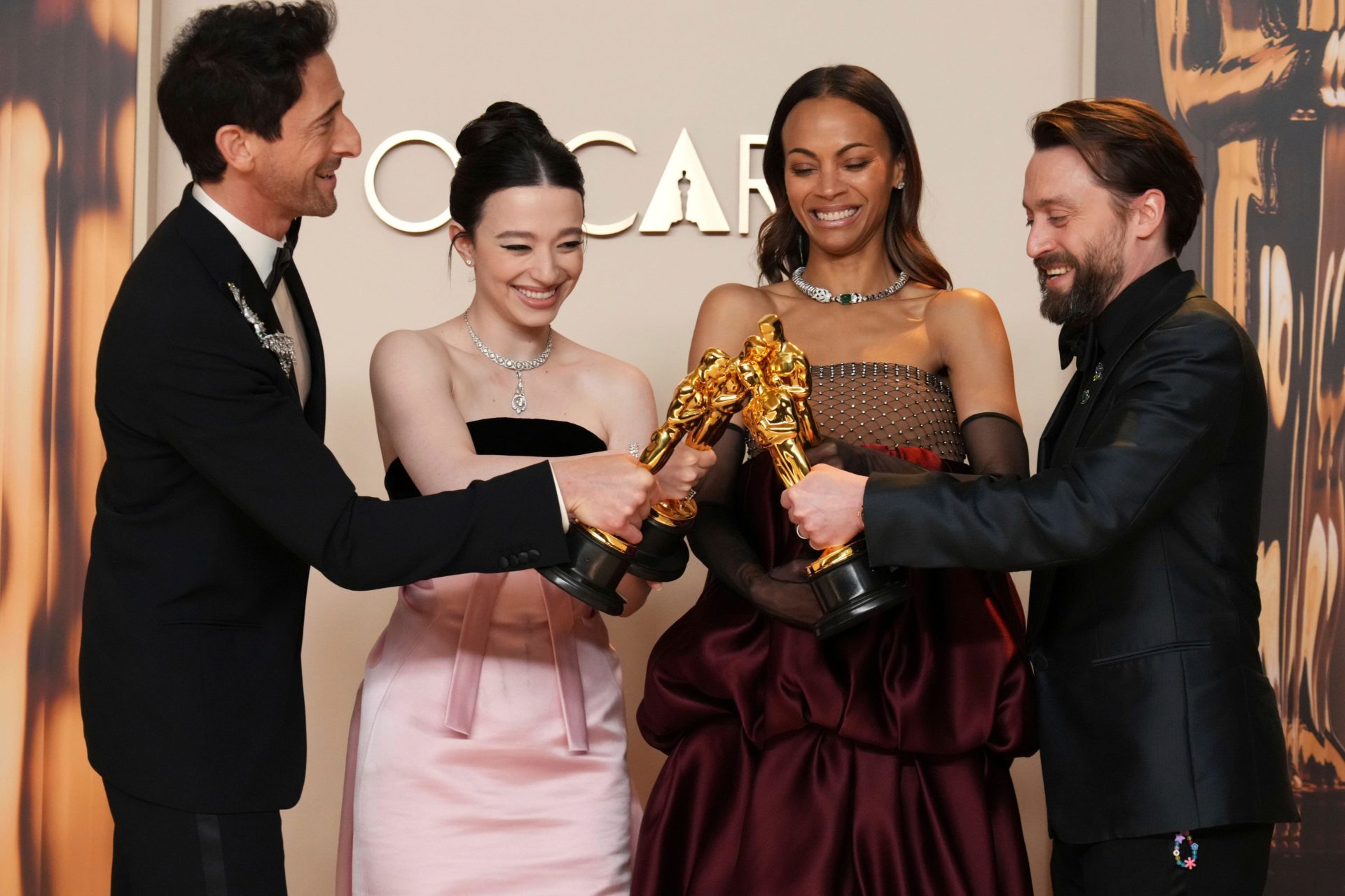 Adrien Brody, from left, winner of the award for best performance by an actor in a leading role for "The Brutalist," Mikey Madison, winner of the award for best performance by an actress in a leading role for "Anora," Zoe Saldana, winner of the award for best performance by an actress in a supporting role for "Emilia Perez," and Kieran Culkin, winner of the award for best performance by an actor in a supporting role for "A Real Pain," pose in the press room at the Oscars on Sunday, March 2, 2025, at the Dolby Theatre in Los Angeles.